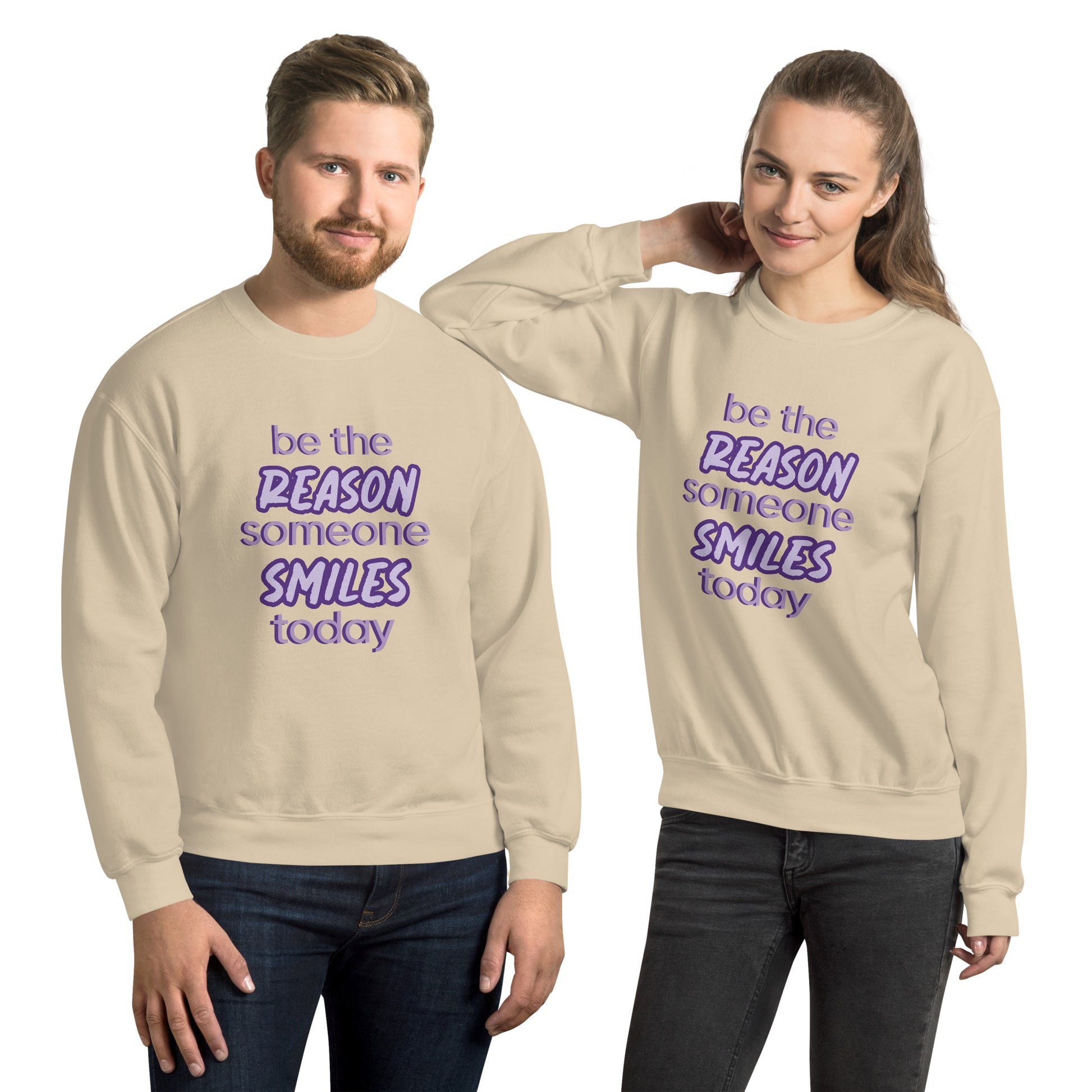 Men and women with sand sweatershirt and the quote "be the reason someone smiles today" in purple on it. 