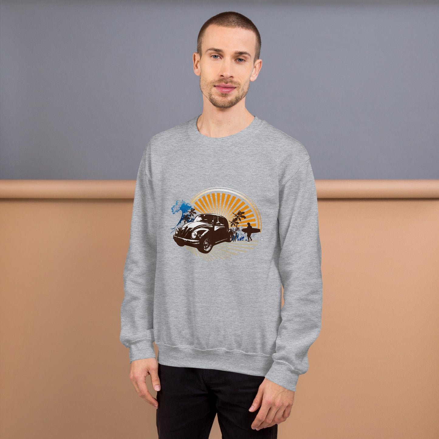 Men with grey sweatshirt with sunset and beetle car