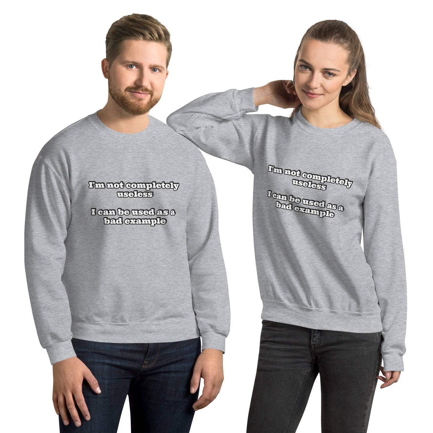 Man and women with grey sweatshirt with text “I'm not completely useless I can be used as a bad example”