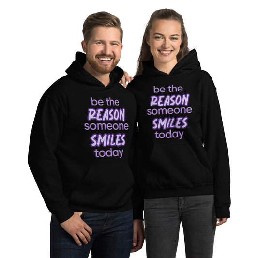 Men and women with Black hoodie and the quote "be the reason someone smiles today" in purple on it. 