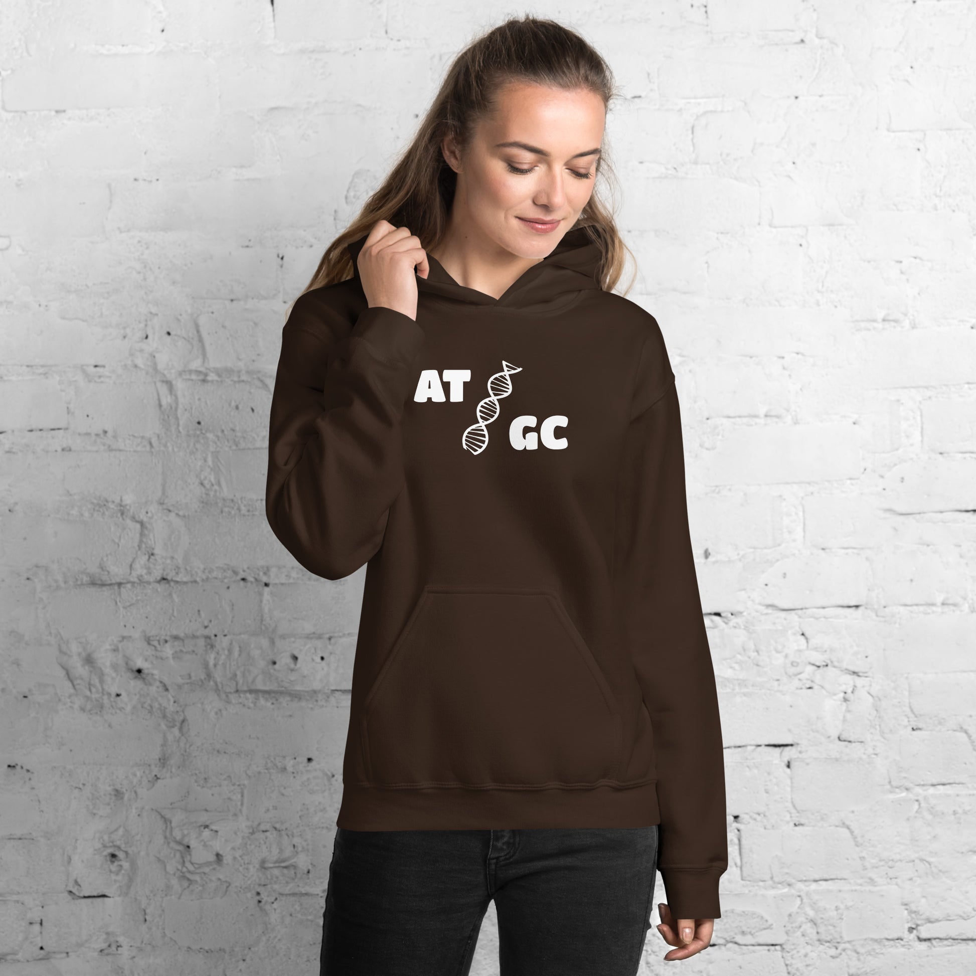 Women with dark brown hoodie with image of a DNA string and the text "ATGC"