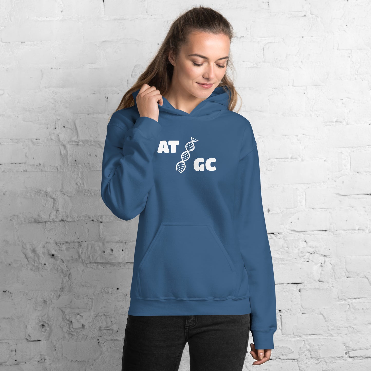 Women with indigo blue hoodie with image of a DNA string and the text "ATGC"