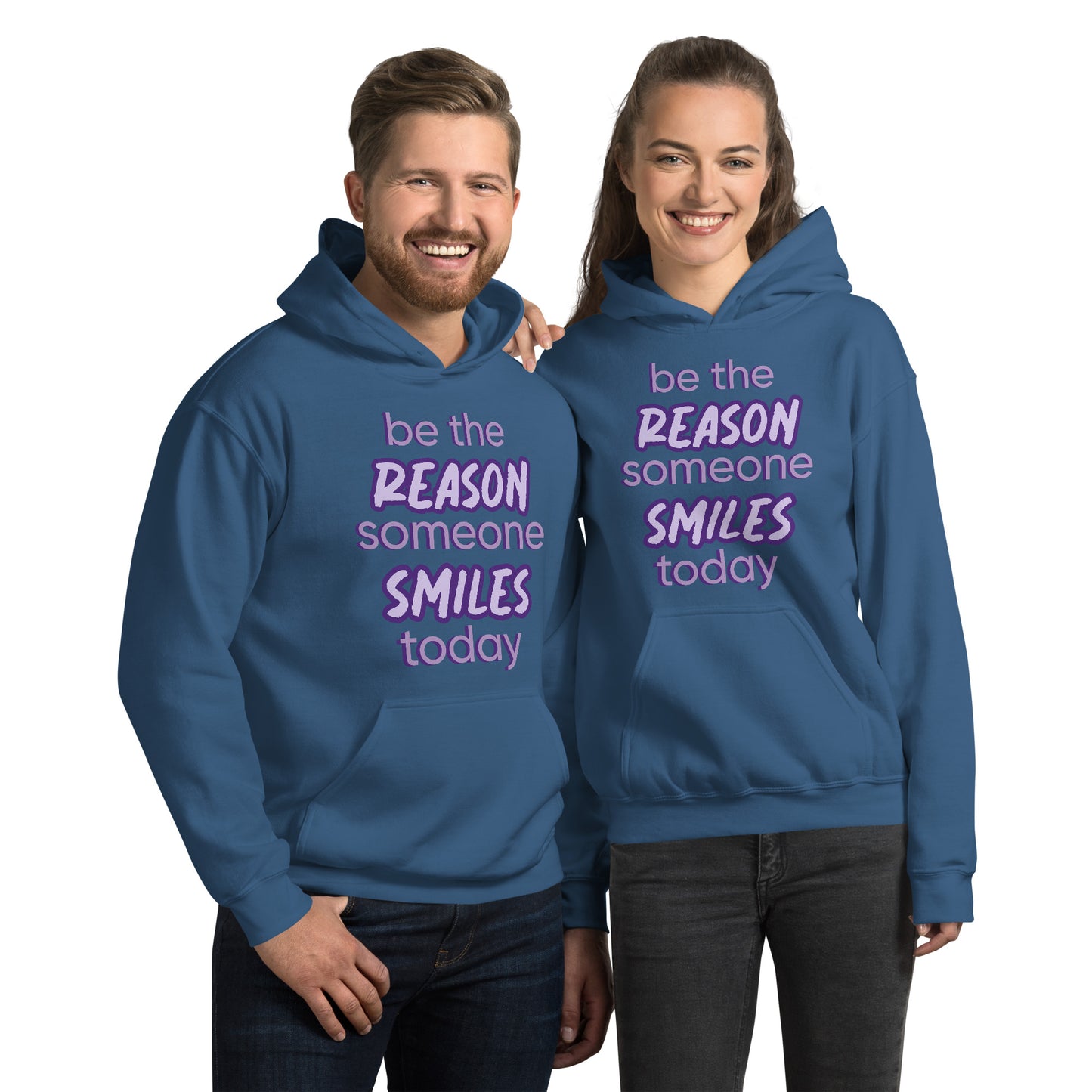 Men and women with indigo blue hoodie and the quote "be the reason someone smiles today" in purple on it. 
