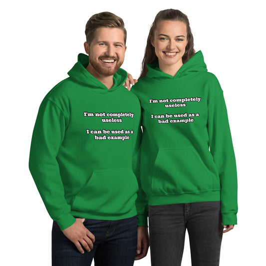 Man and women with Irish green hoodie with text “I'm not completely useless I can be used as a bad example”