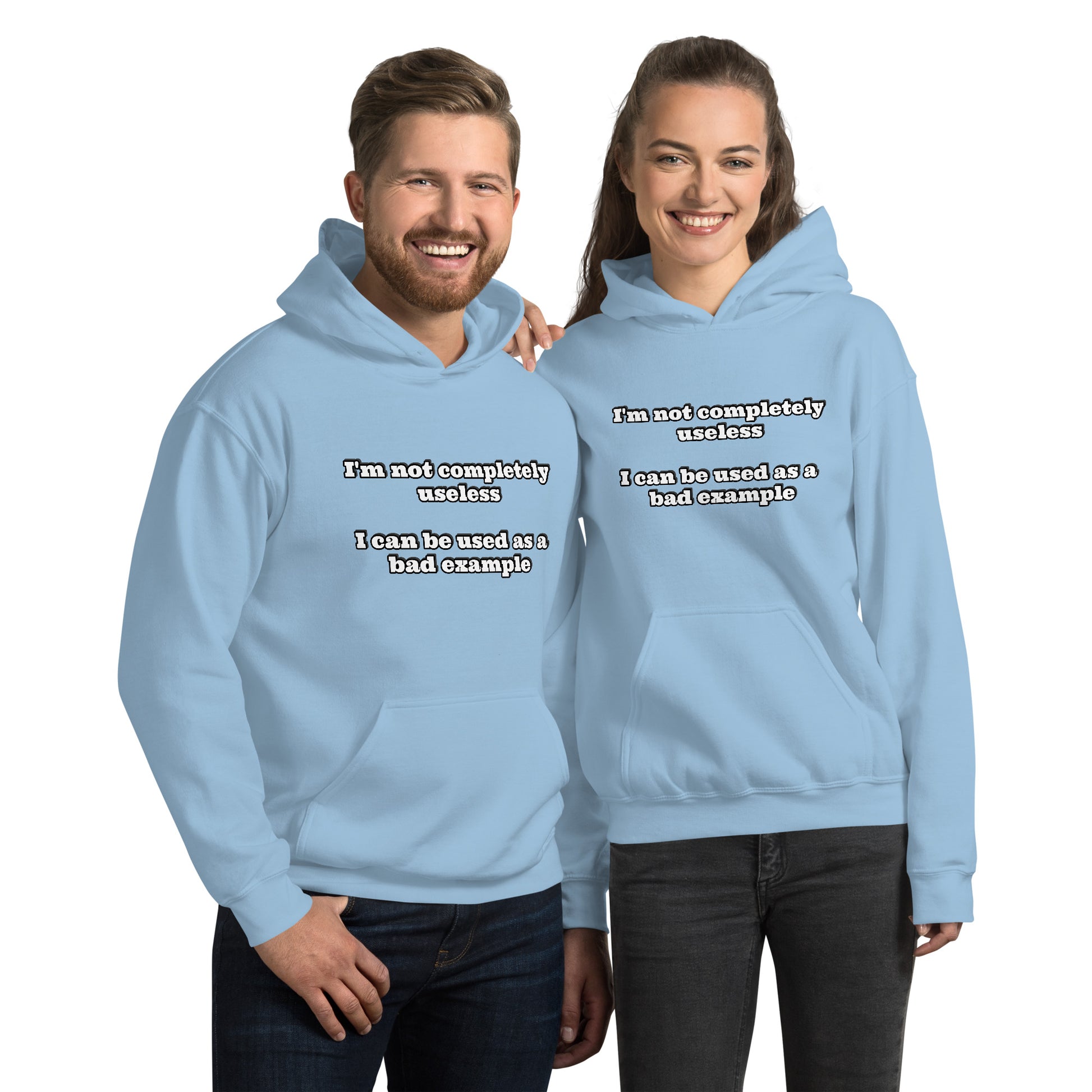Man and women with light blue hoodie with text “I'm not completely useless I can be used as a bad example”