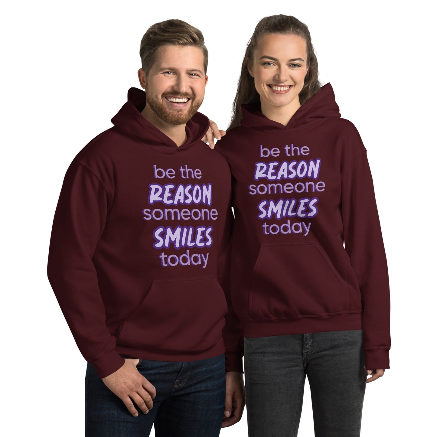 Men and women with maroon hoodie and the quote "be the reason someone smiles today" in purple on it.