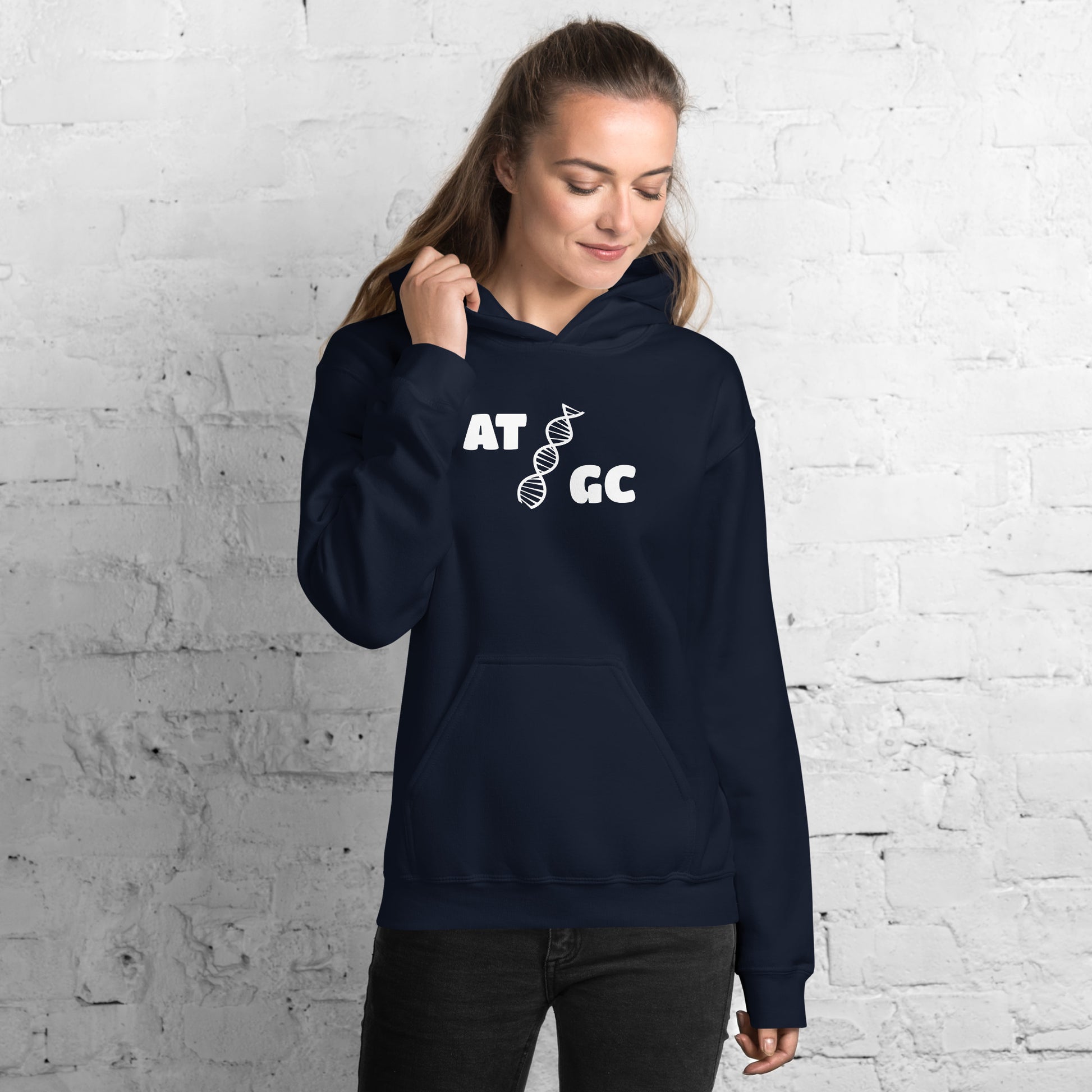 Women with navy blue hoodie with image of a DNA string and the text "ATGC"