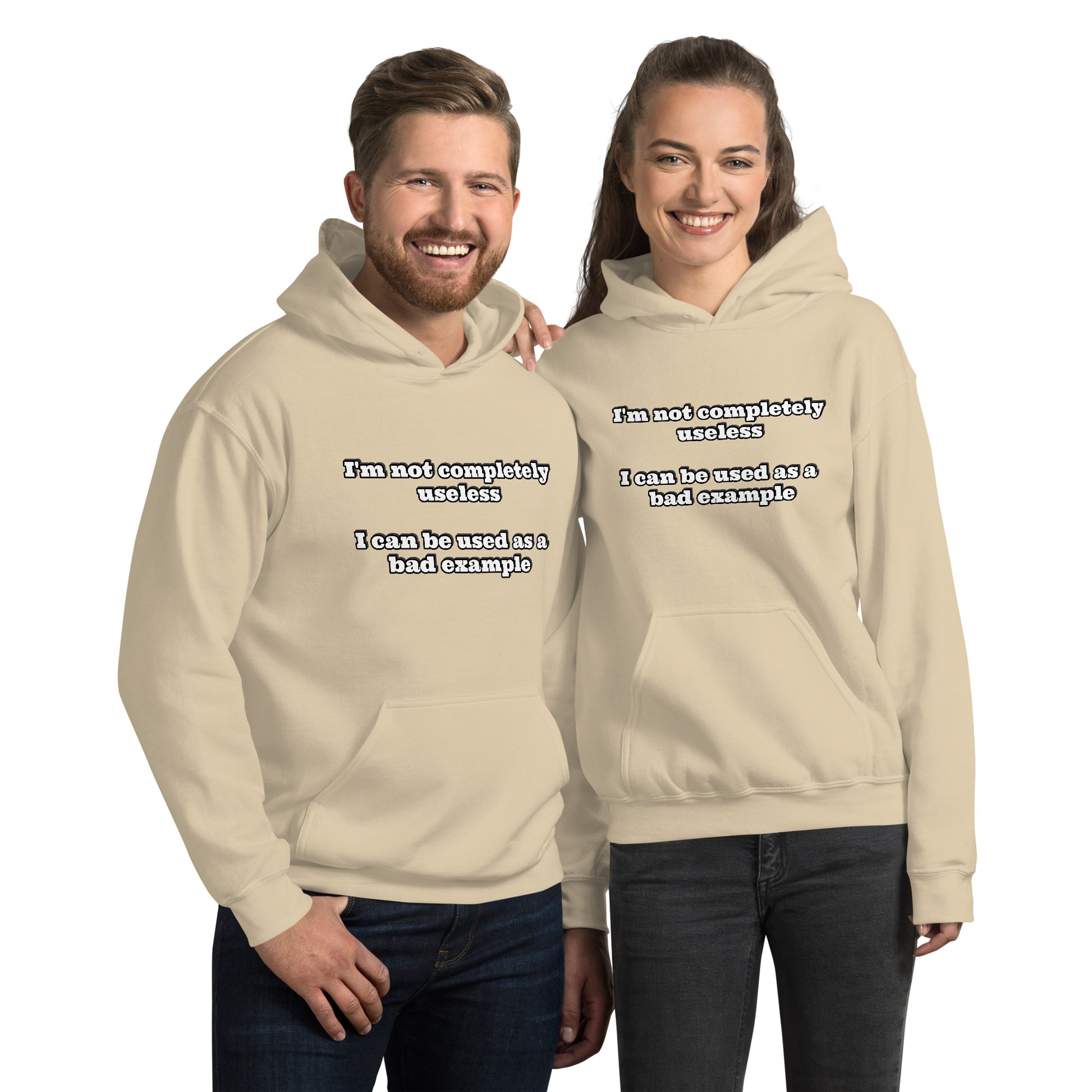 Man and women with sand hoodie with text “I'm not completely useless I can be used as a bad example”