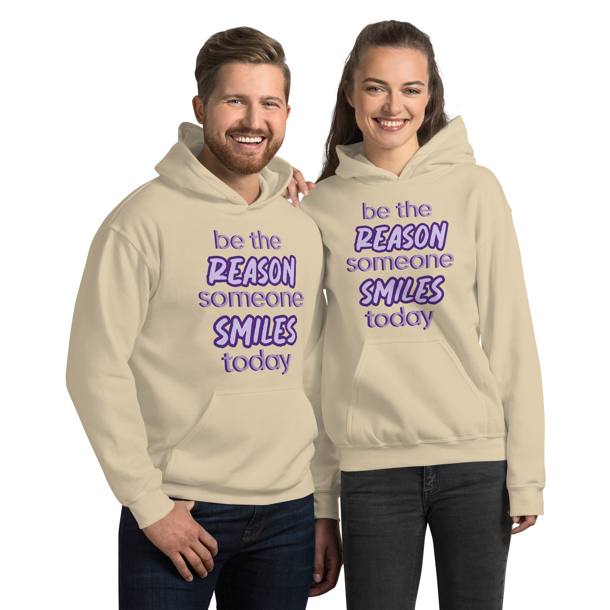 Men and women with sand hoodie and the quote "be the reason someone smiles today" in purple on it. 