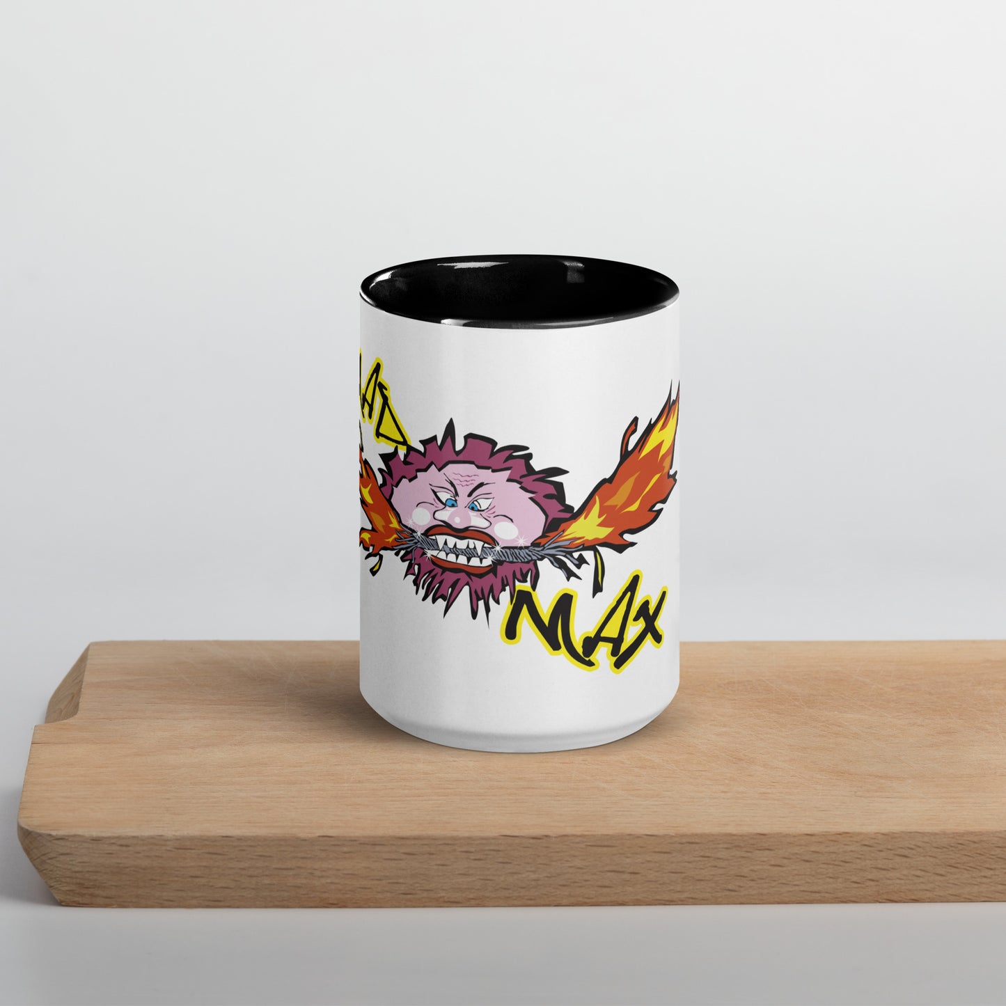 White ceramic mug with mad mad logo and black inside