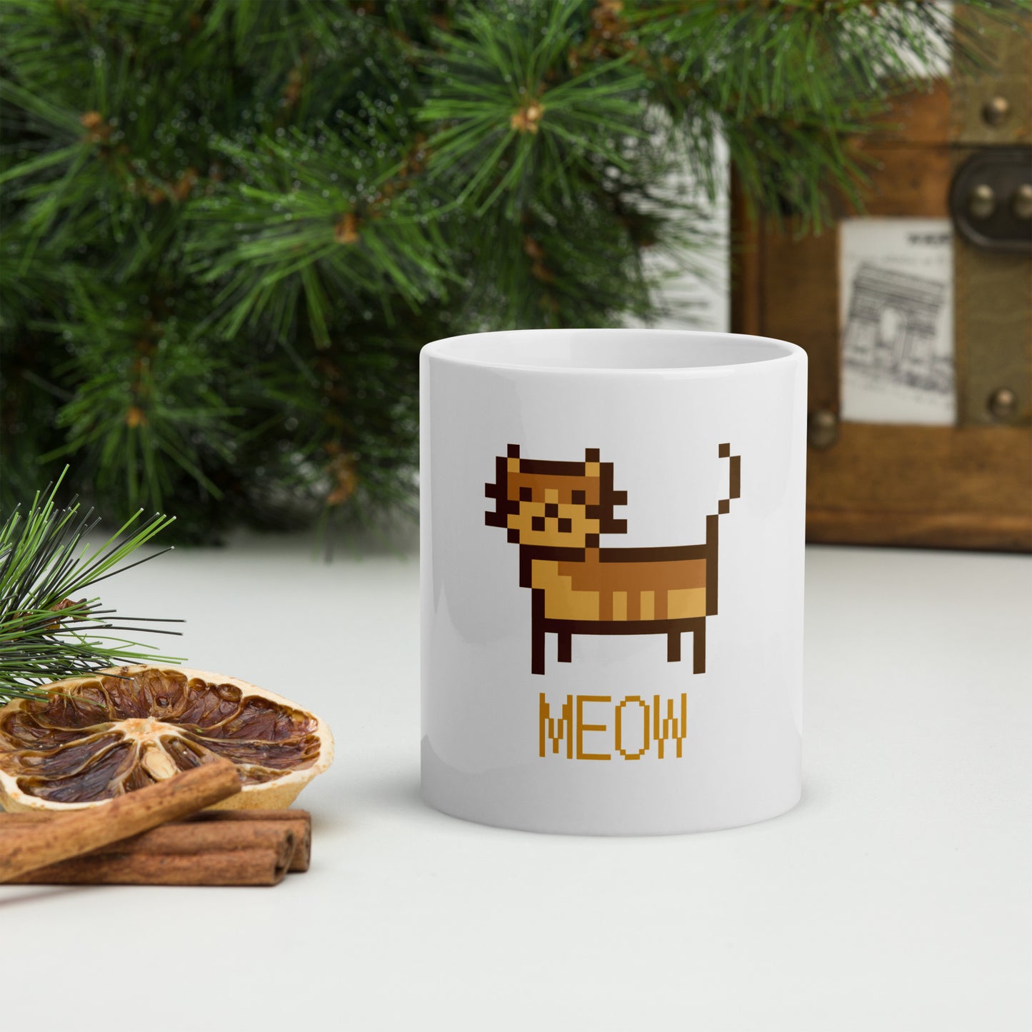 white mug with print of a cat and text "meow"