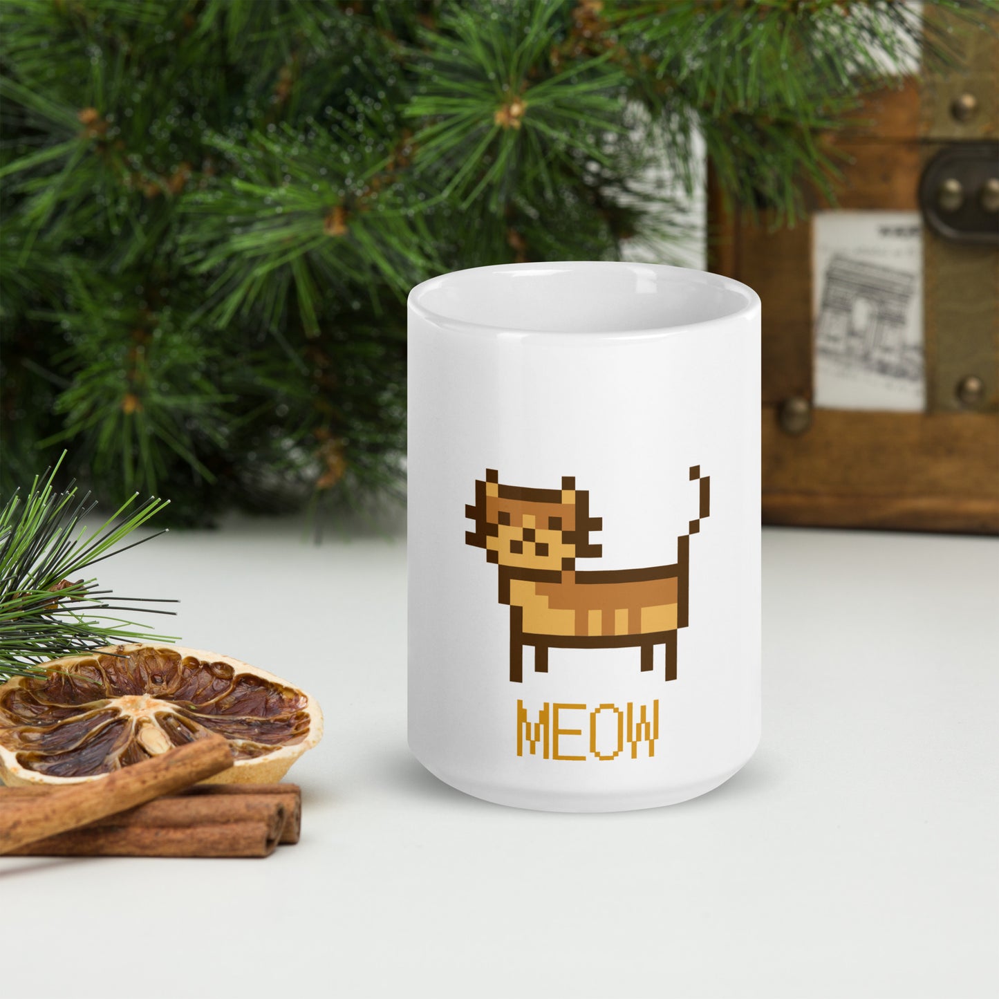 white mug with print of a cat and text "meow"