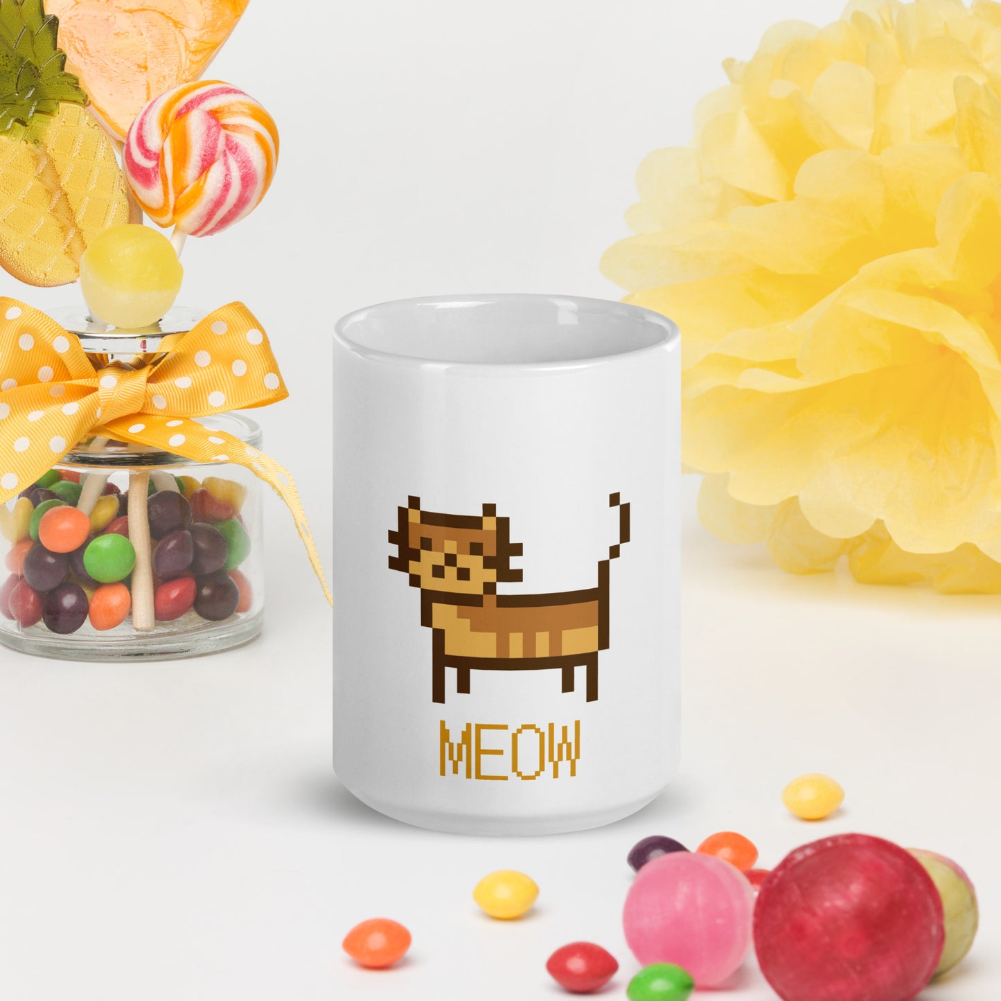 white mug with print of a cat and text "meow"