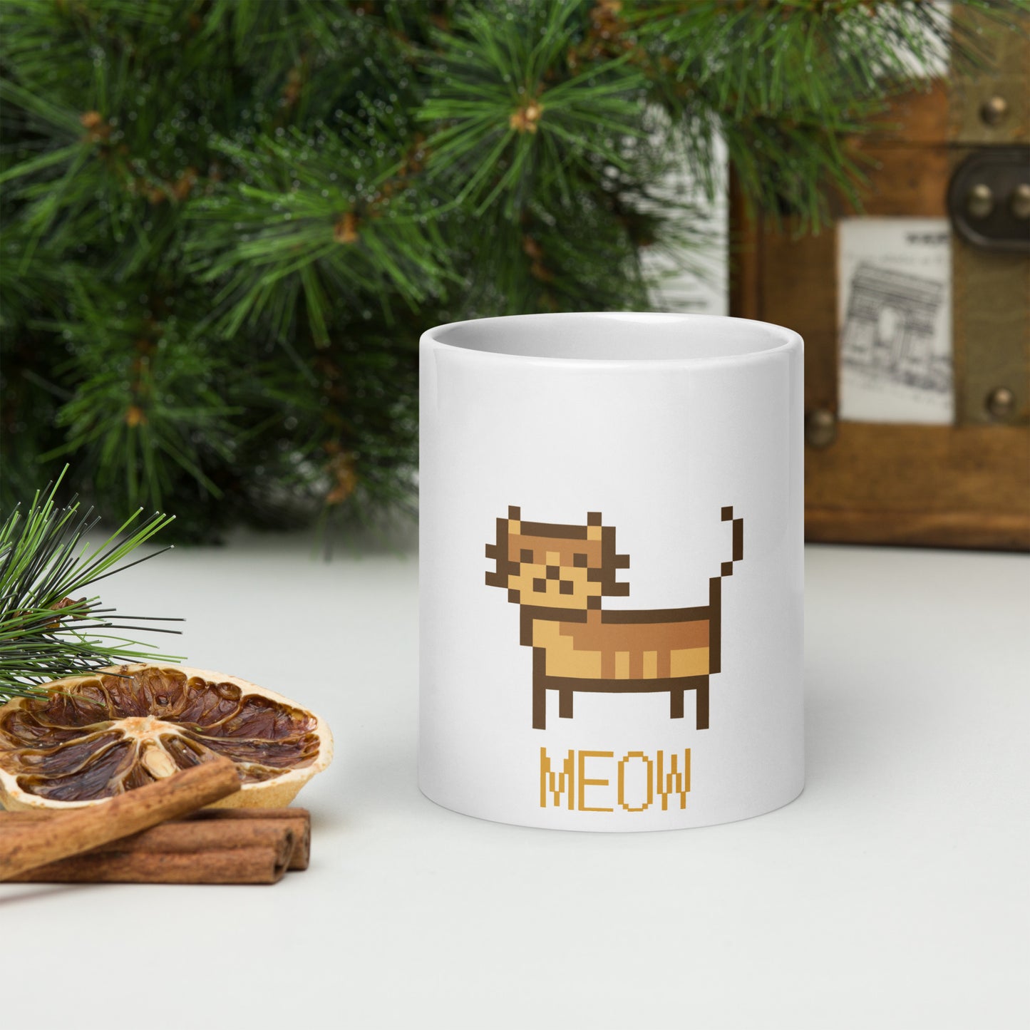 white mug with print of a cat and text "meow"
