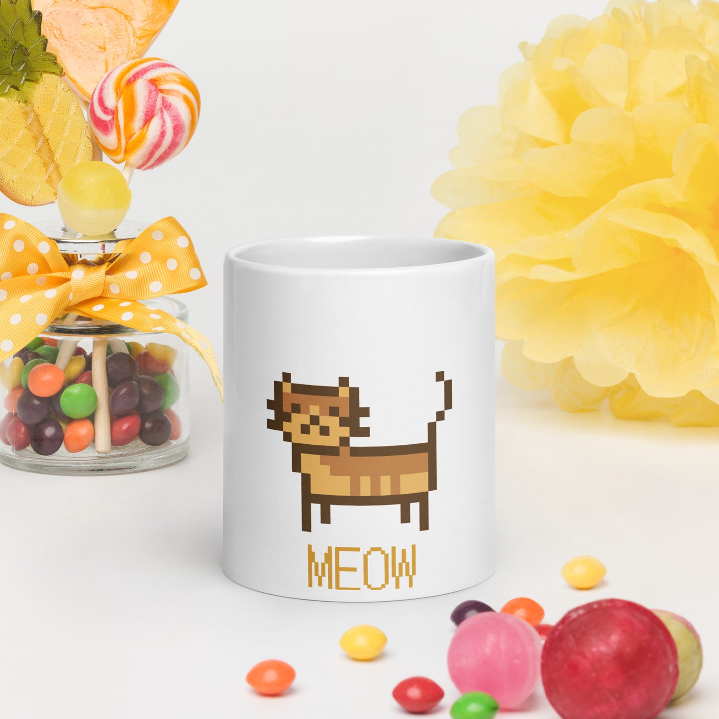 white mug with print of a cat and text "meow"