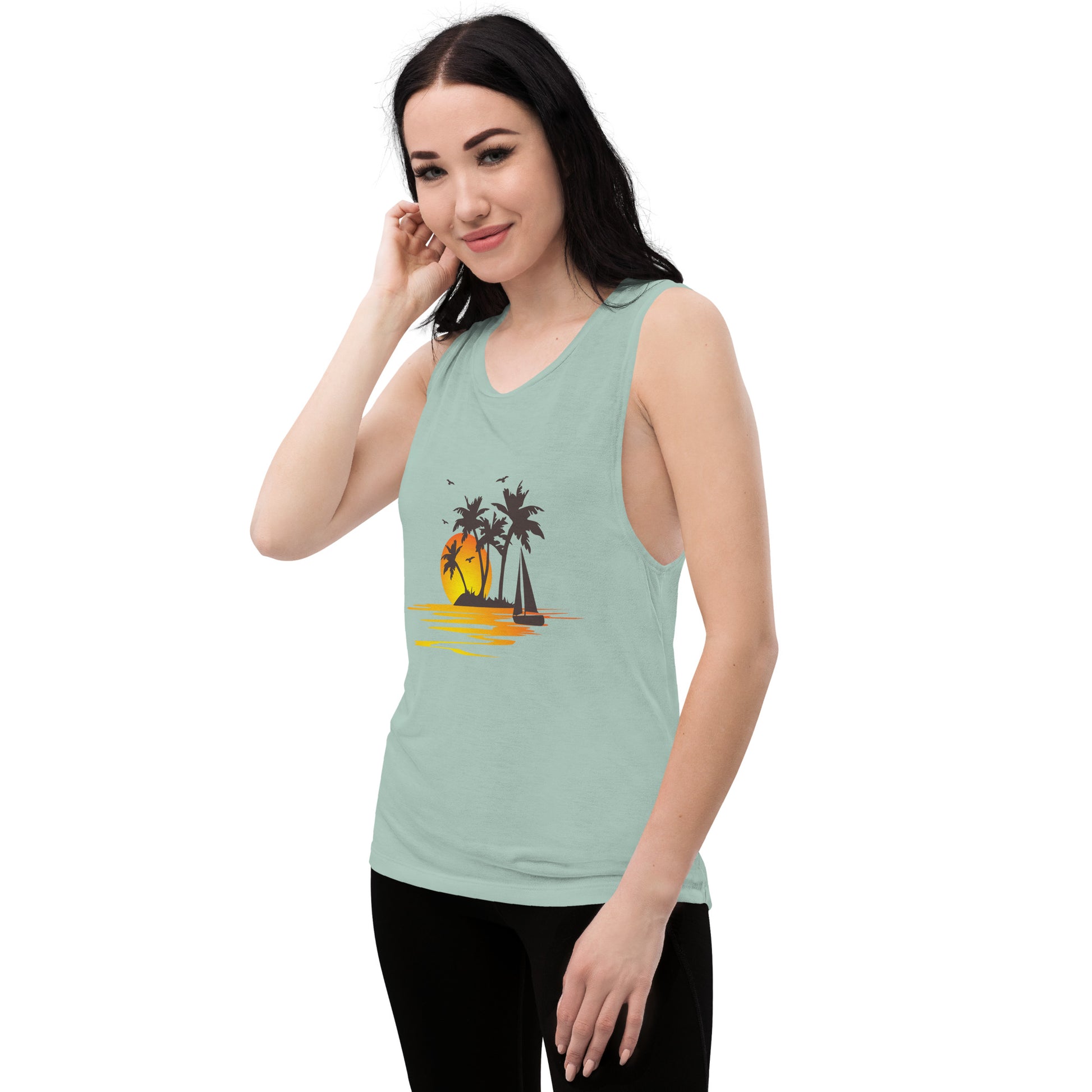 Women with dusty blue muscle tank with a picture of sunset, palm trees and sailboat