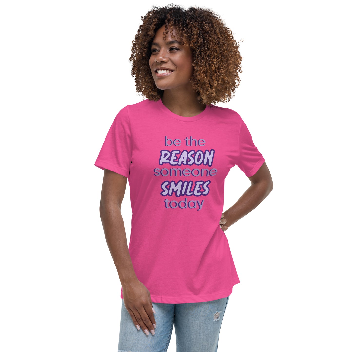 Woman with berry T-shirt and the quote "be the reason someone smiles today" in purple on it. 