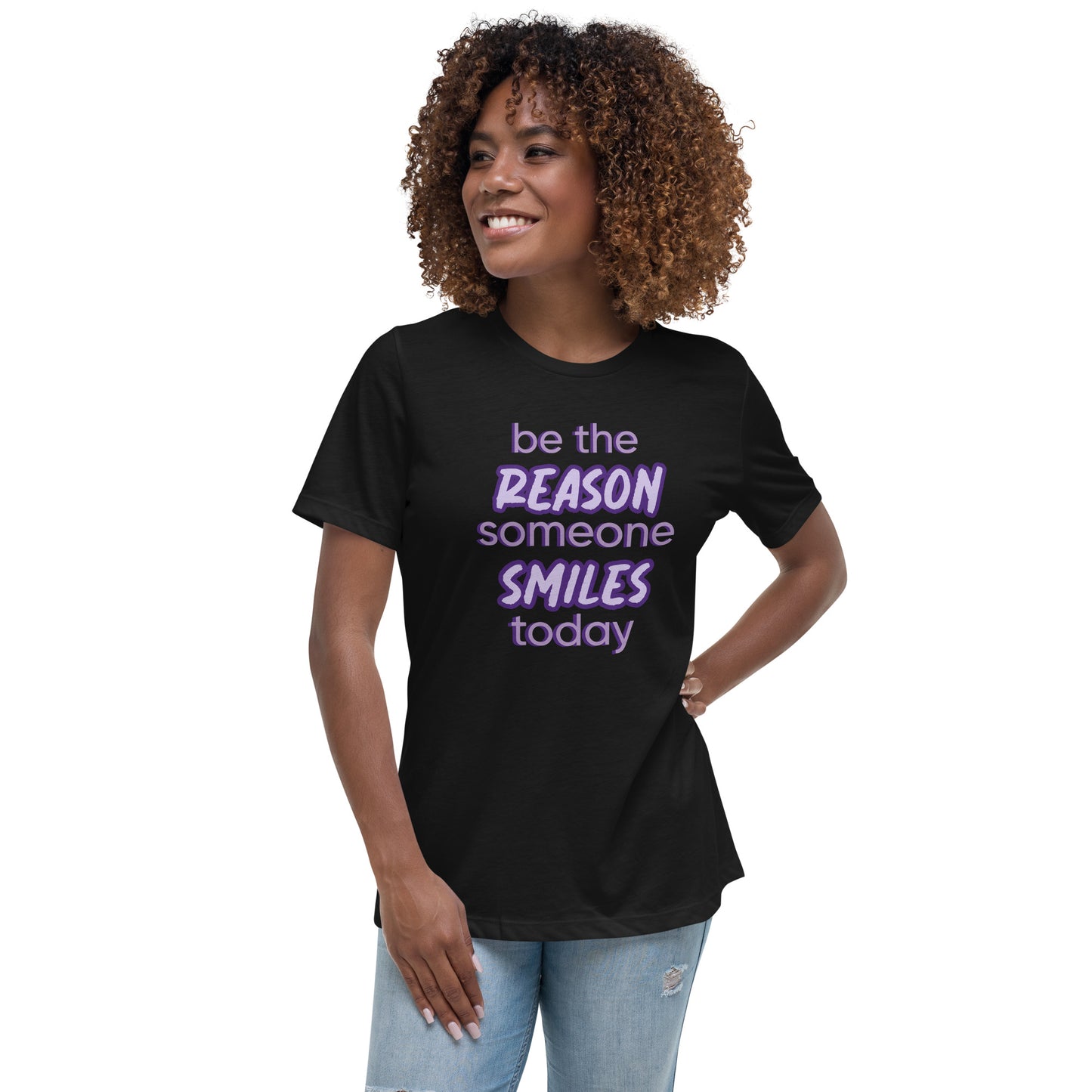Woman with black T-shirt and the quote "be the reason someone smiles today" in purple on it.