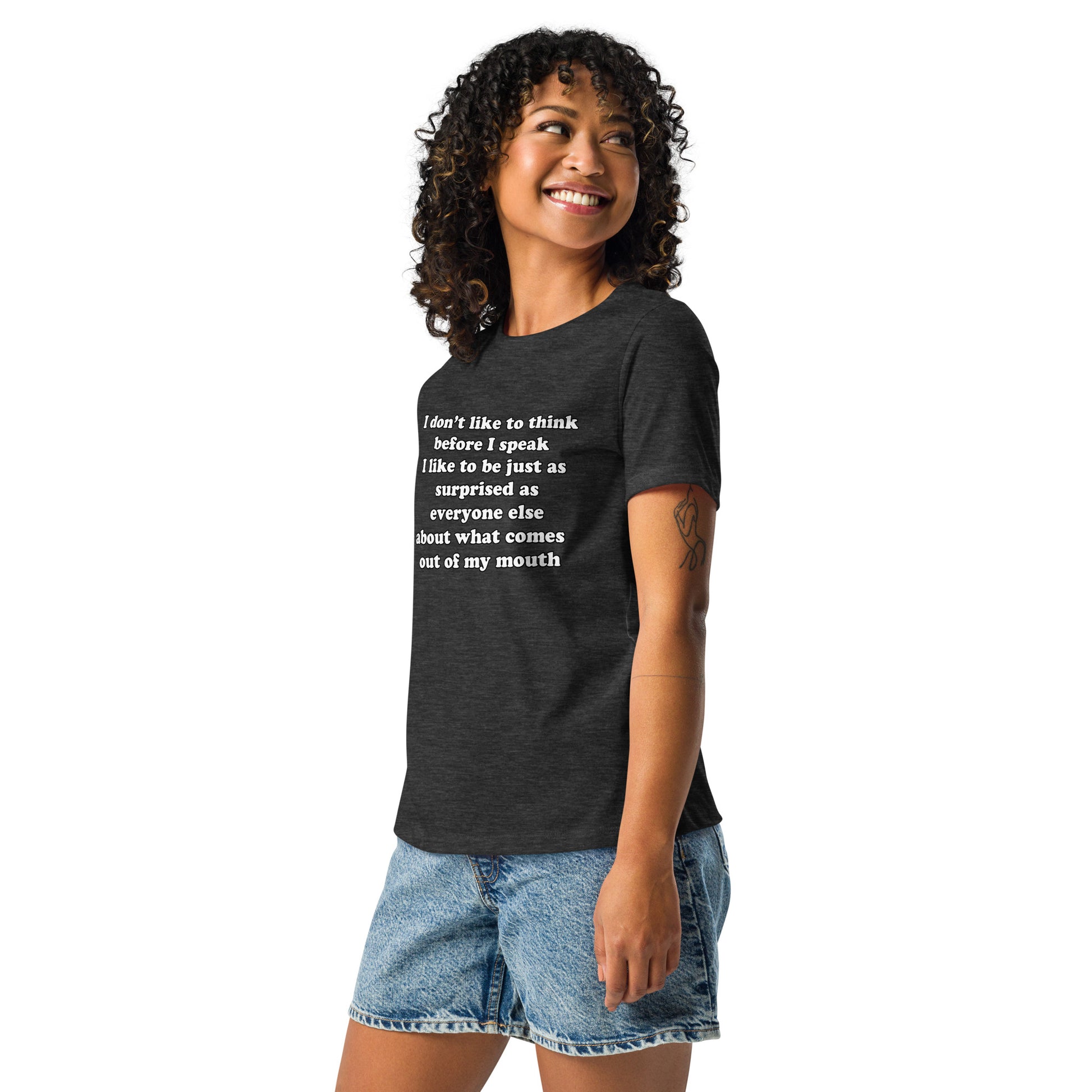 Woman with dark grey t-shirt with text “I don't think before I speak Just as serprised as everyone about what comes out of my mouth"