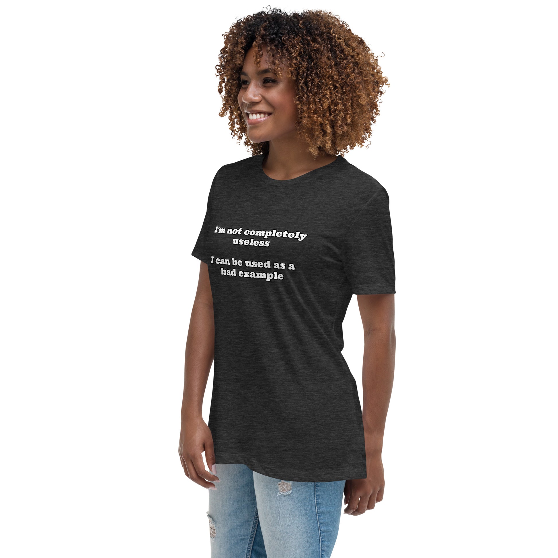 Women with dark grey t-shirt with text “I'm not completely useless I can be used as a bad example”