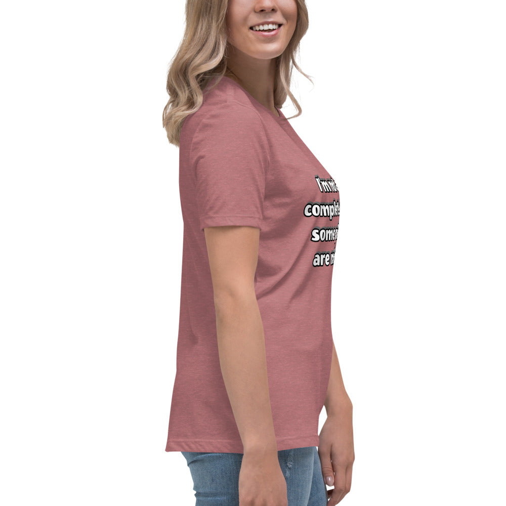 Women with mauve t-shirt with text “I’m not a complete idiot, some pieces are missing”