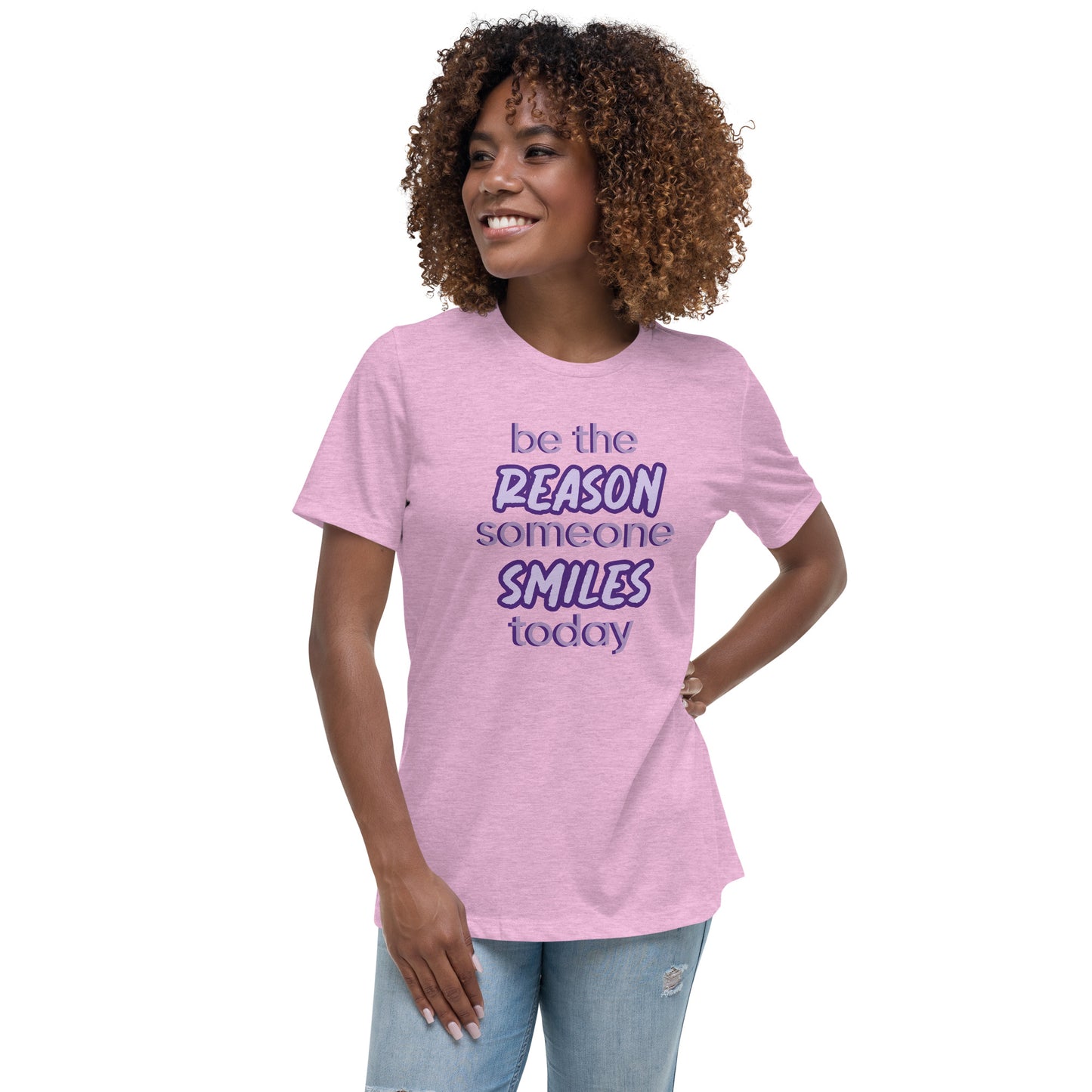 Woman with prism lilac T-shirt and the quote "be the reason someone smiles today" in purple on it.