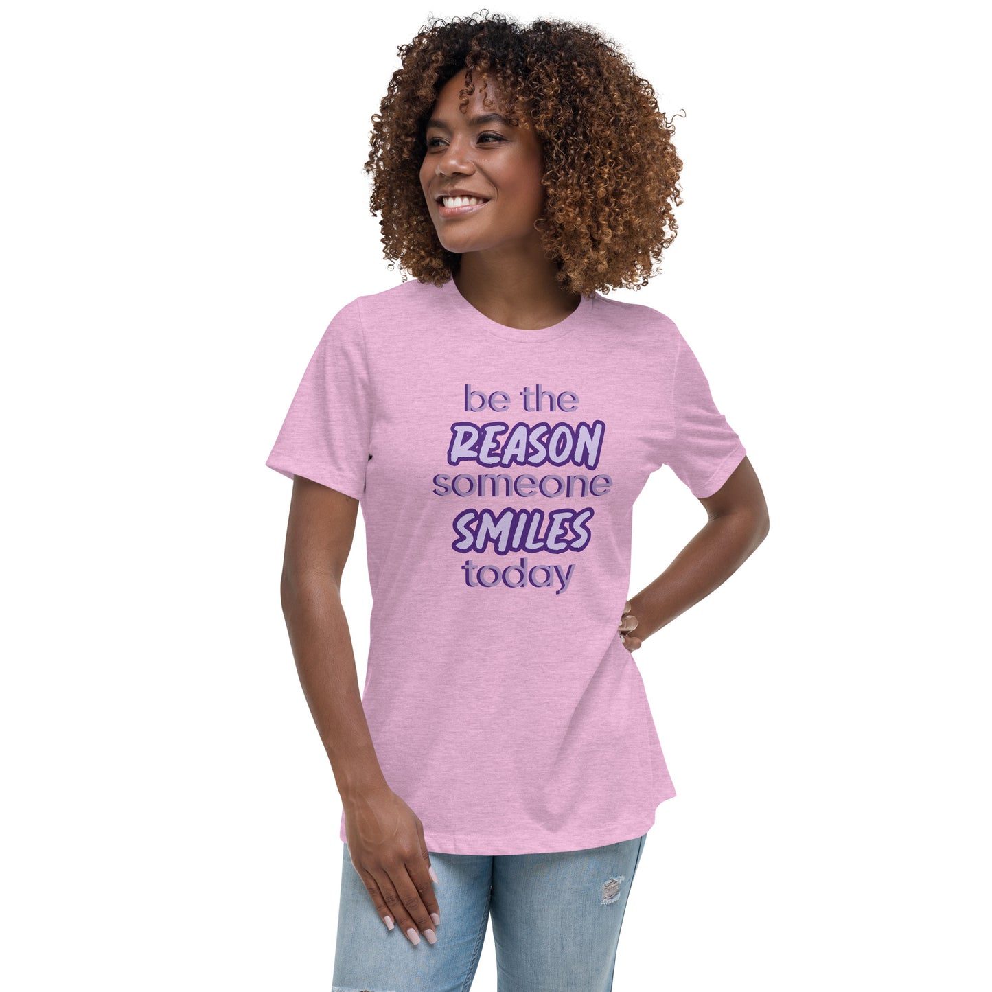 Woman with prism lilac T-shirt and the quote "be the reason someone smiles today" in purple on it. 