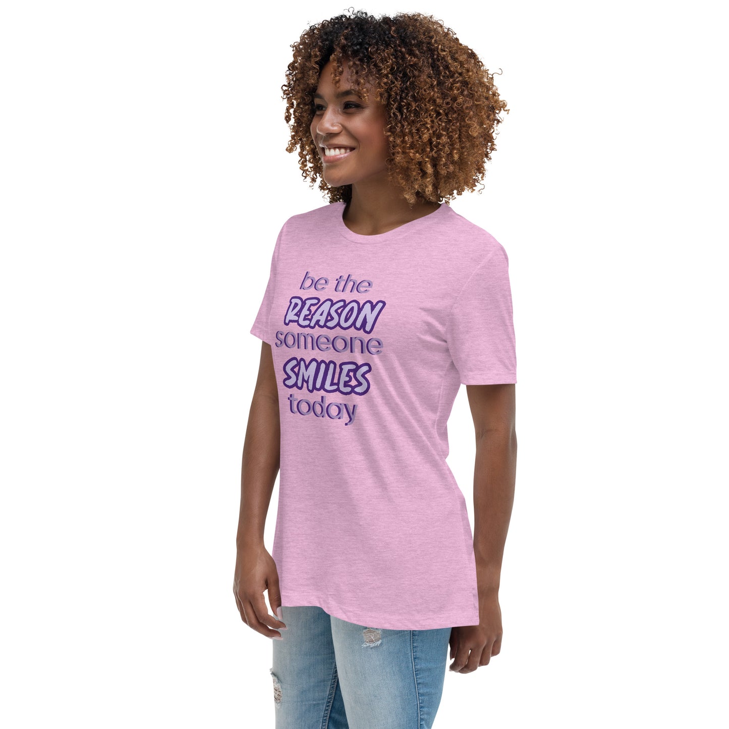 Woman with prism lilac T-shirt and the quote "be the reason someone smiles today" in purple on it. 