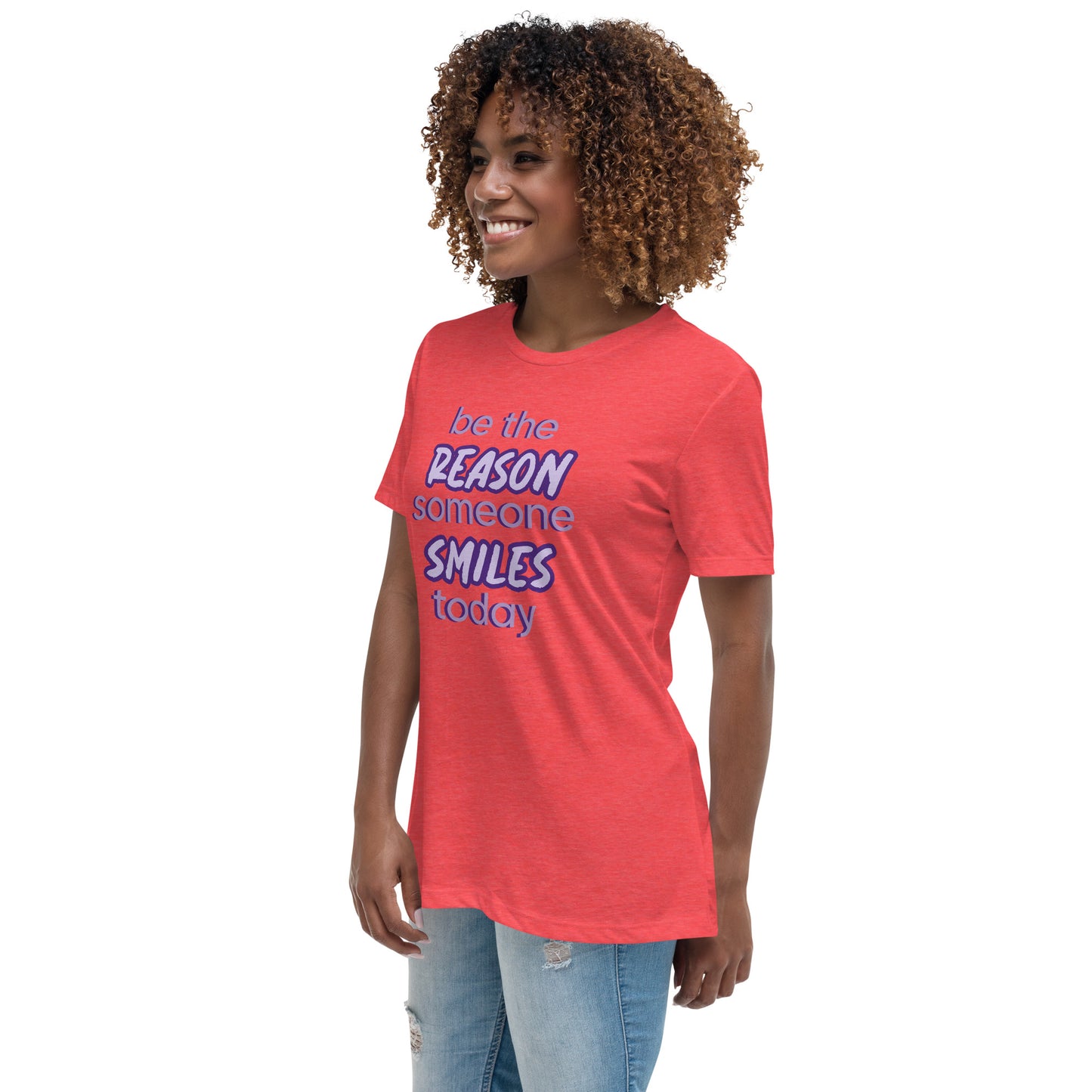 Woman with red T-shirt and the quote "be the reason someone smiles today" in purple on it. 