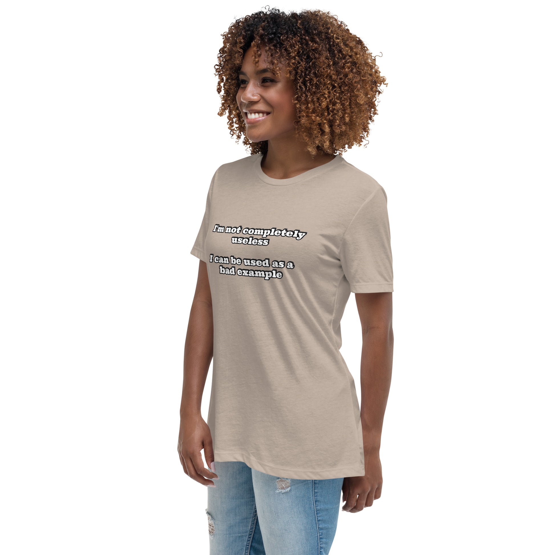 Women with stone brown t-shirt with text “I'm not completely useless I can be used as a bad example”
