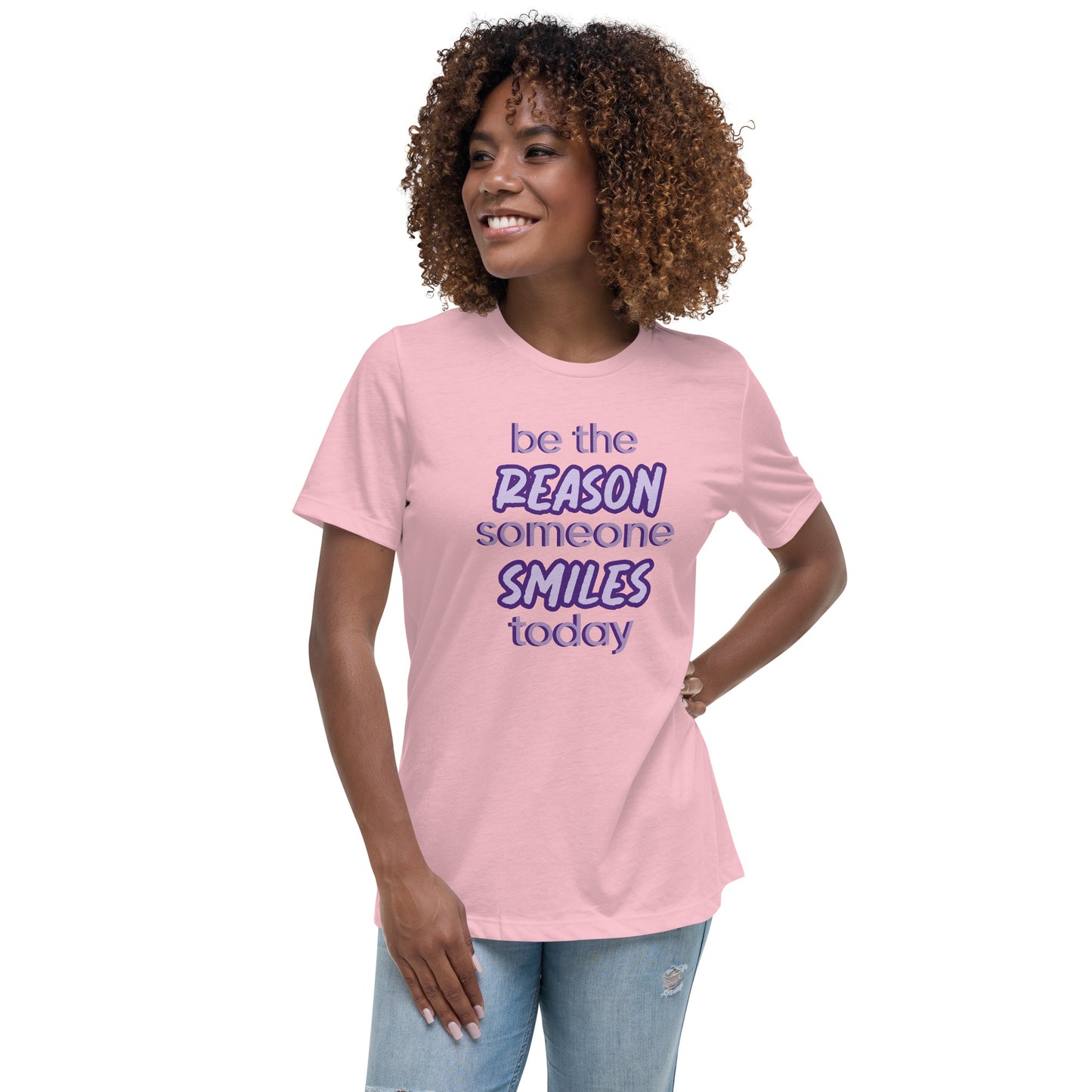 Woman with pink T-shirt and the quote "be the reason someone smiles today" in purple on it.