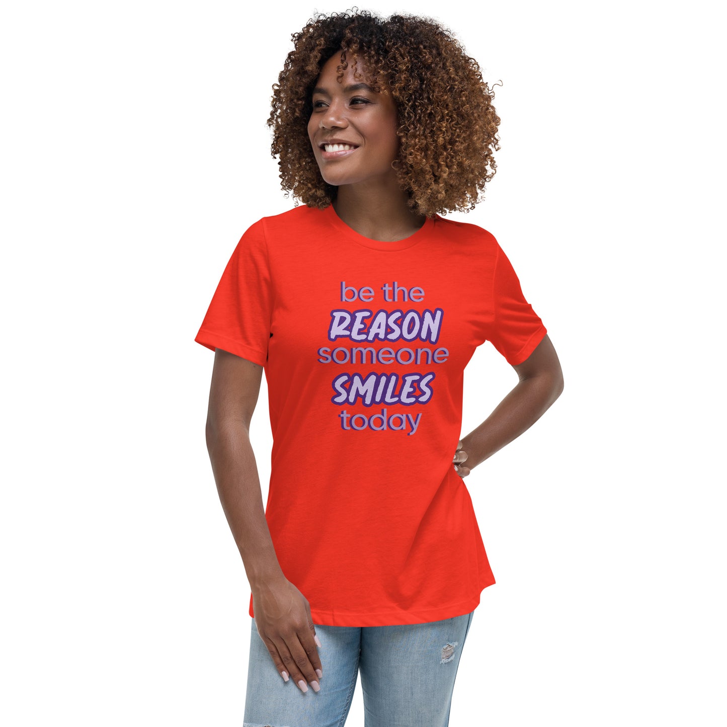 Woman with poppy T-shirt and the quote "be the reason someone smiles today" in purple on it.