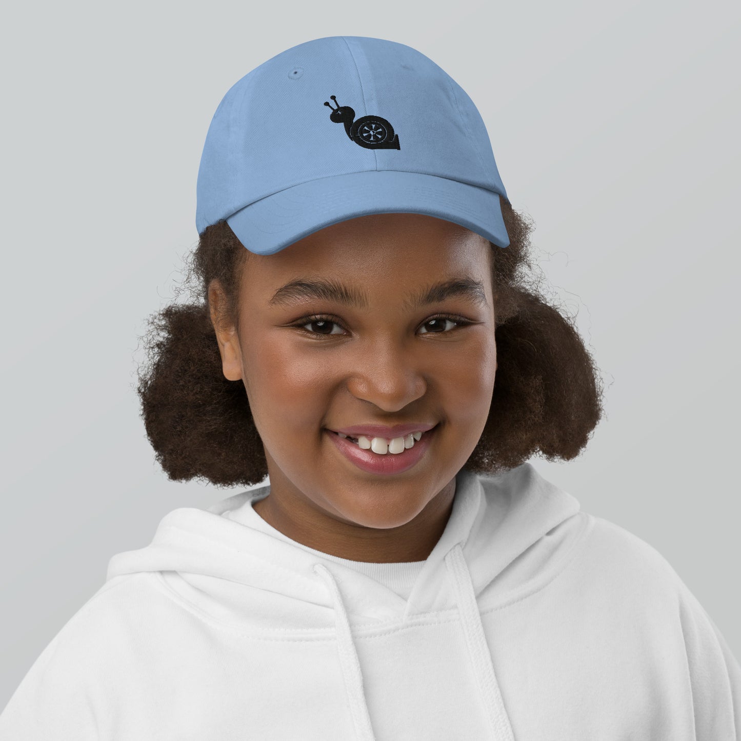 Youth with a light blue baseball cap and a turbo snail print