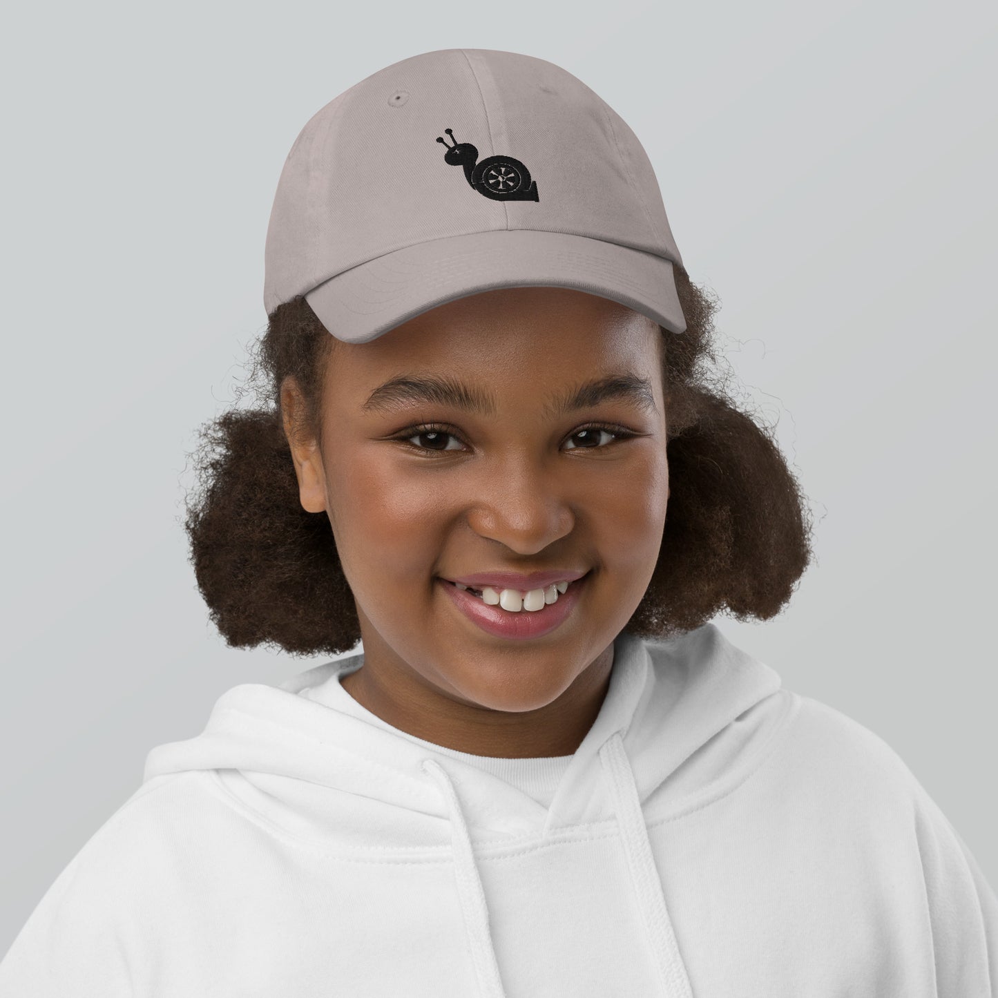 Youth with a grey baseball cap and a turbo snail print