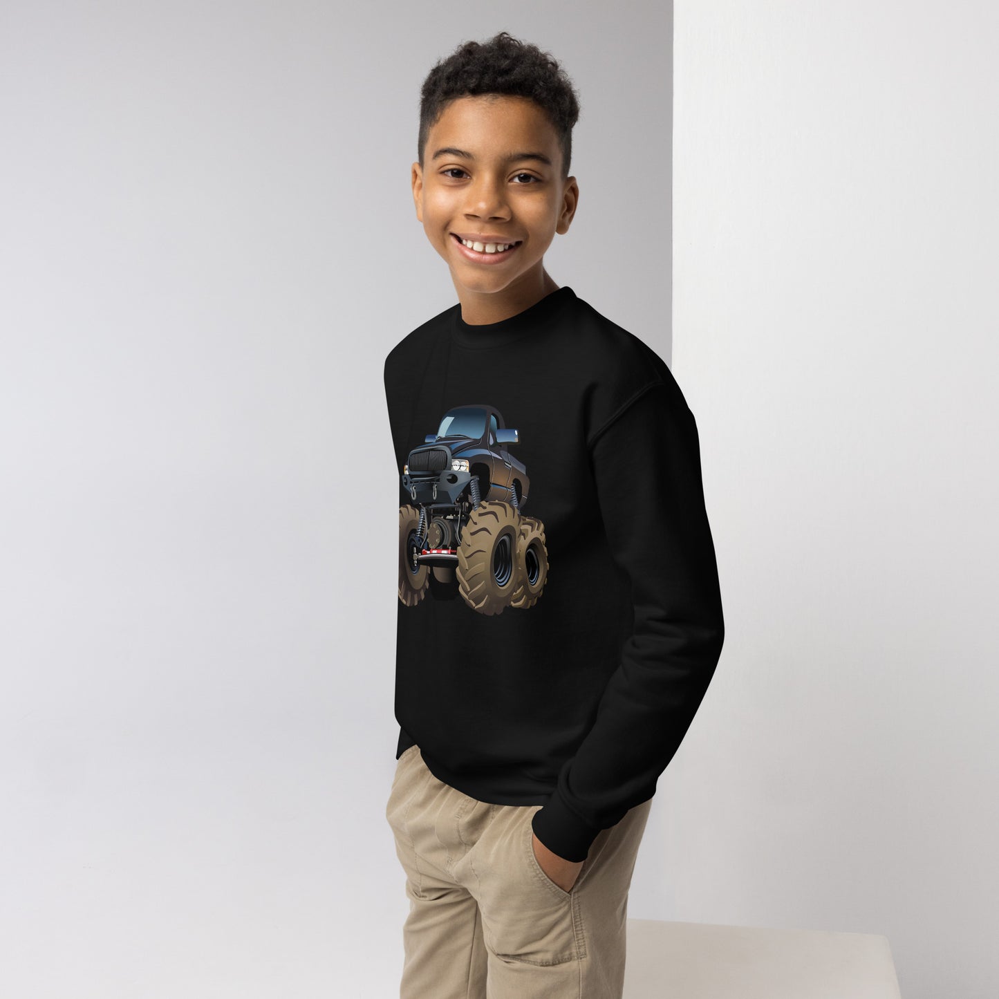 Youth boy with black sweatshirt with picture of a monstertruck