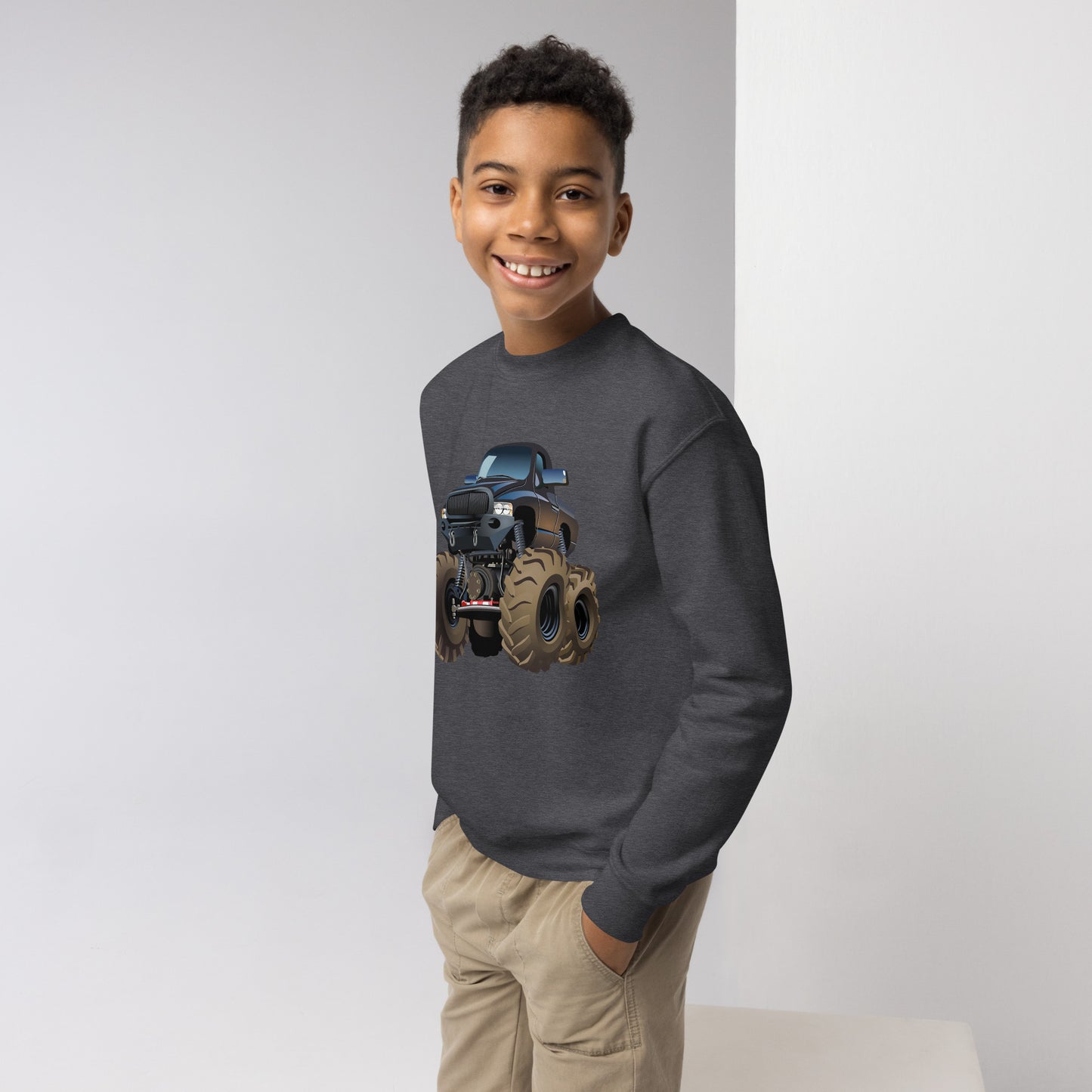 Youth boy with dark heather sweatshirt with picture of a monstertruck
