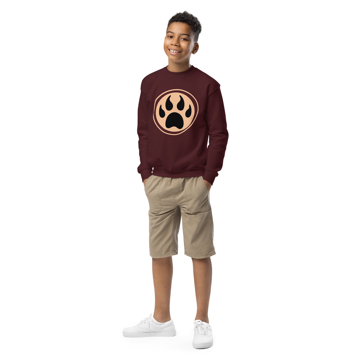 Youth with maroon sweatshirt and a print of a wolf claw