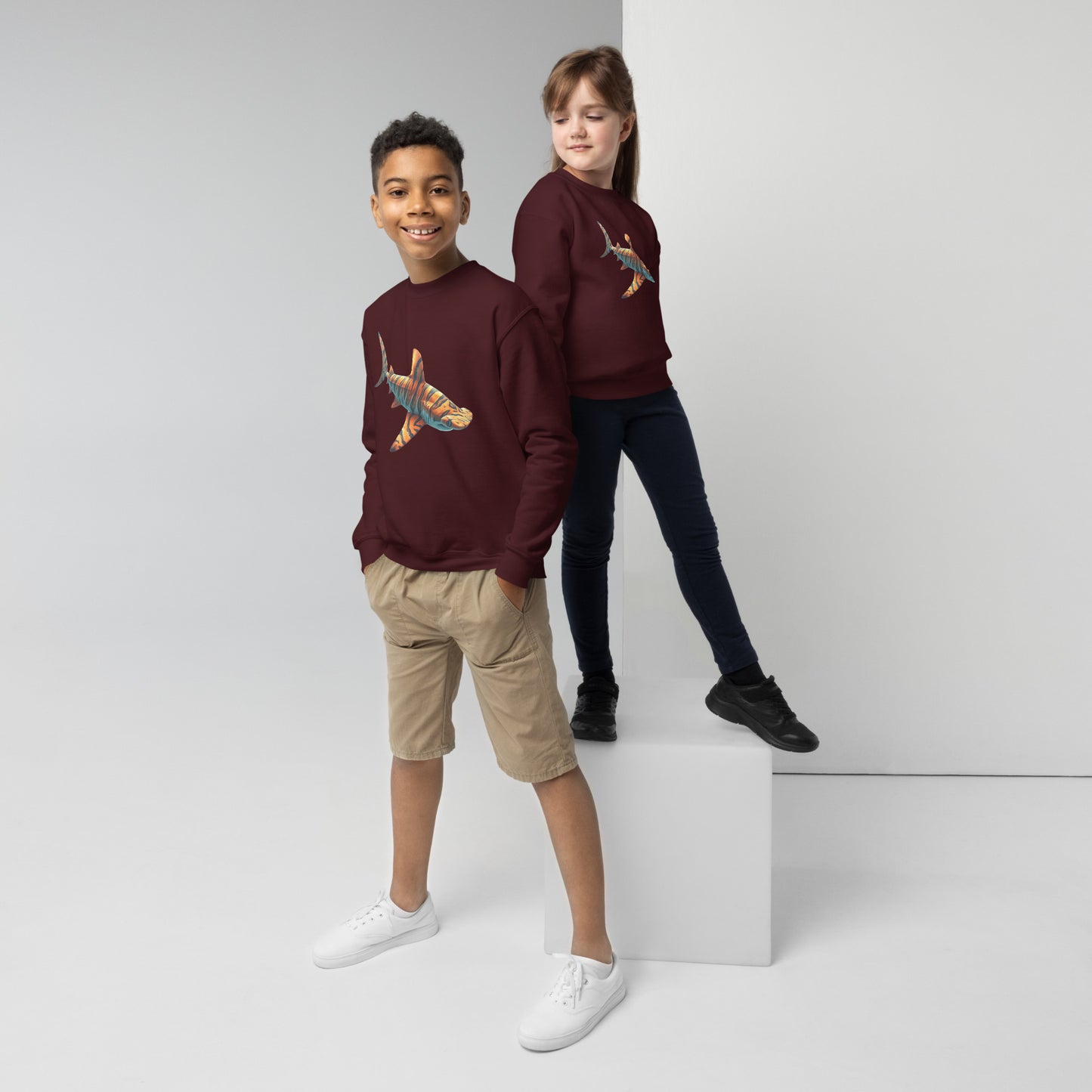 Maroon sweatshirt for youth with a print of a hammerhead shark
