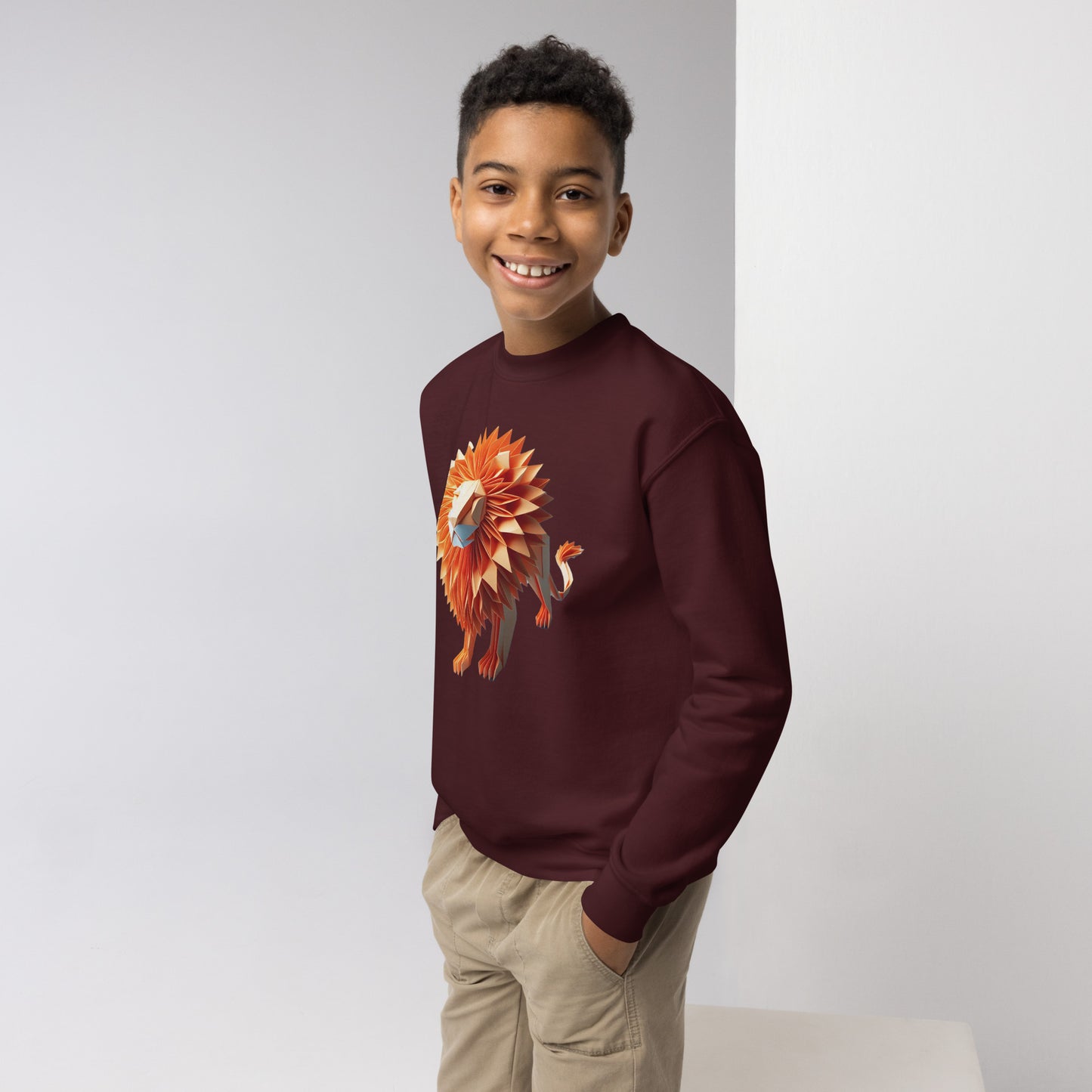 Youth with maroon Sweater with print of a lion