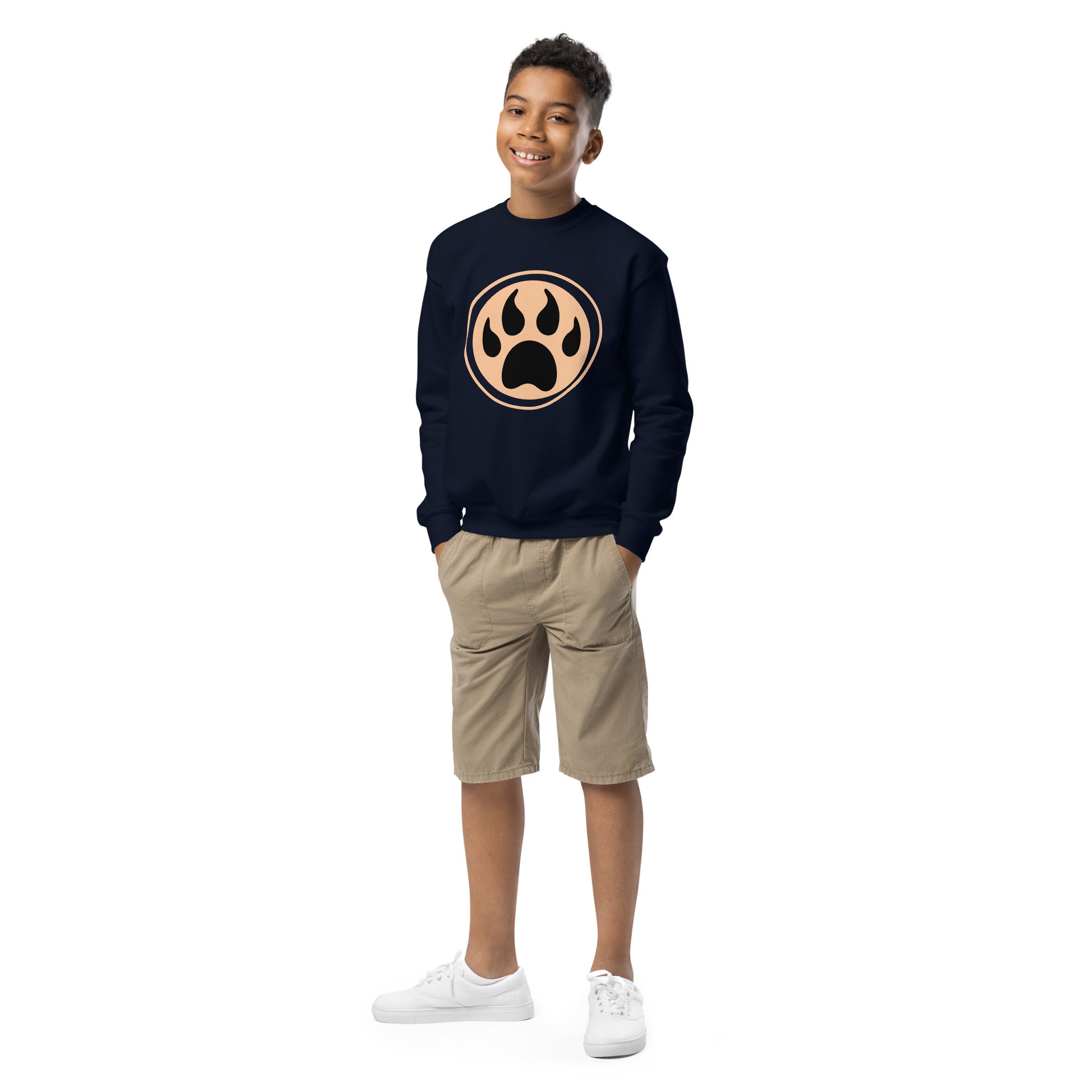 Youth with navy sweatshirt and a print of a wolf claw