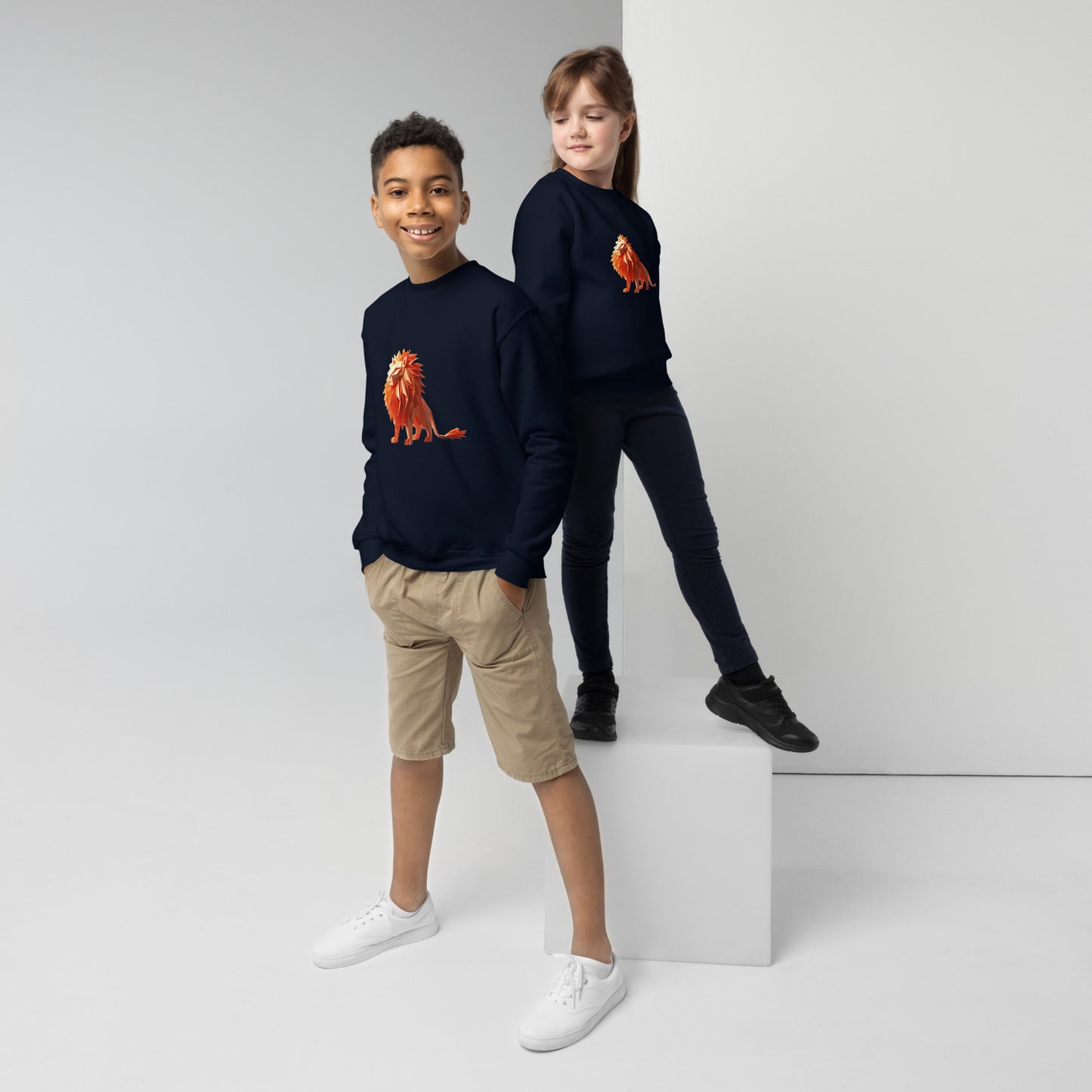 Youth with a navy sweatshirt with a print of a lion