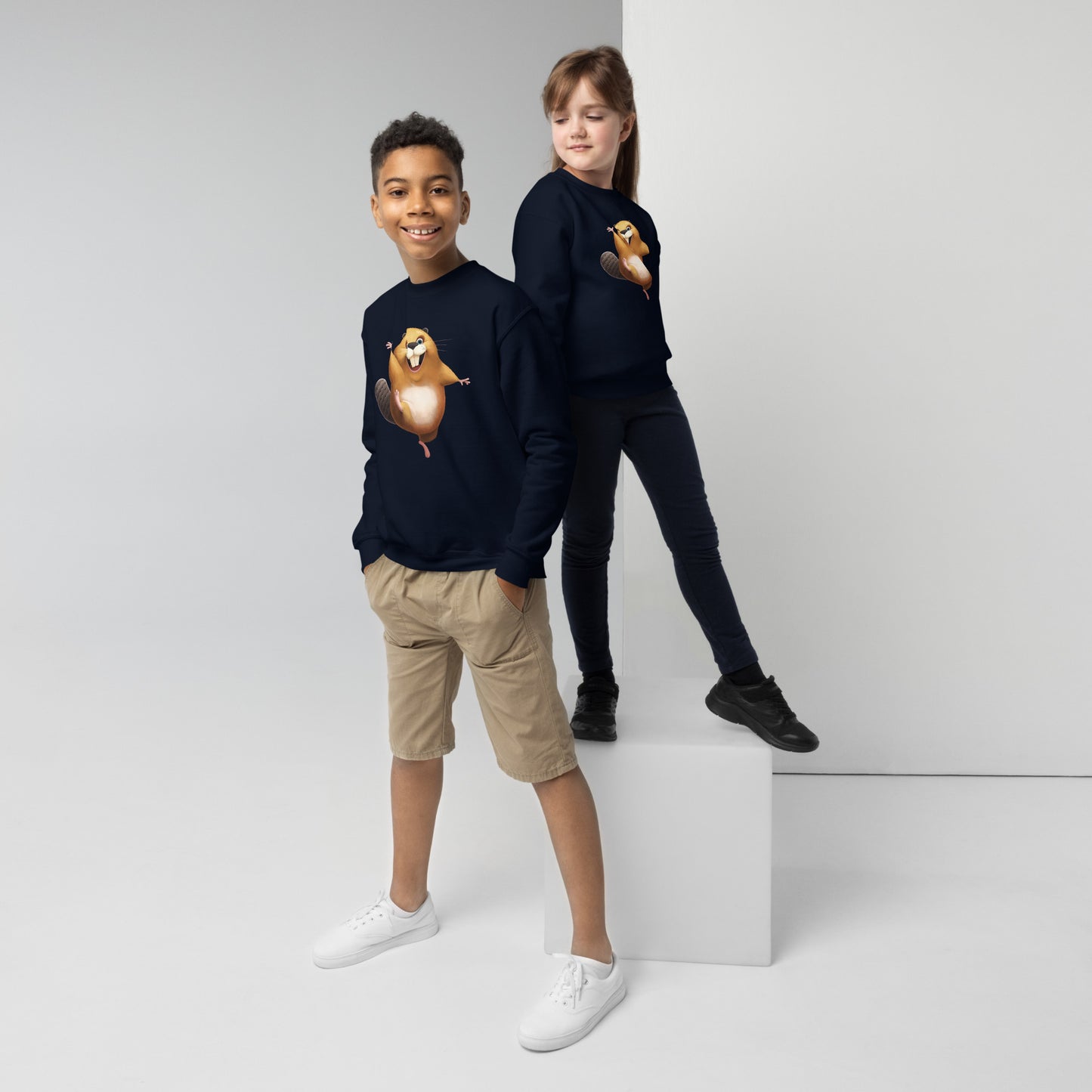 Youth (girl and boy) with navy sweatshirt with happy beaver