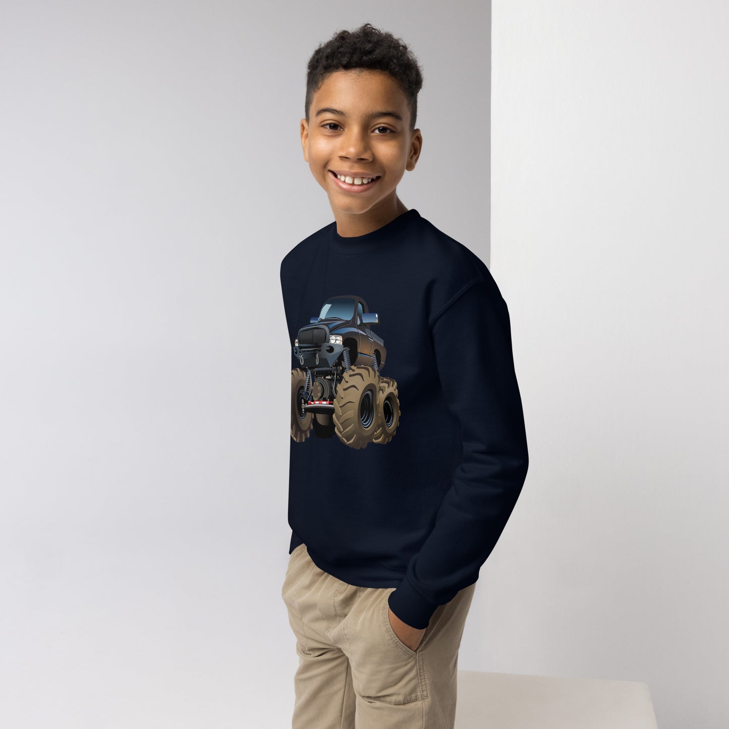 Youth boy with navy sweatshirt with picture of a monstertruck