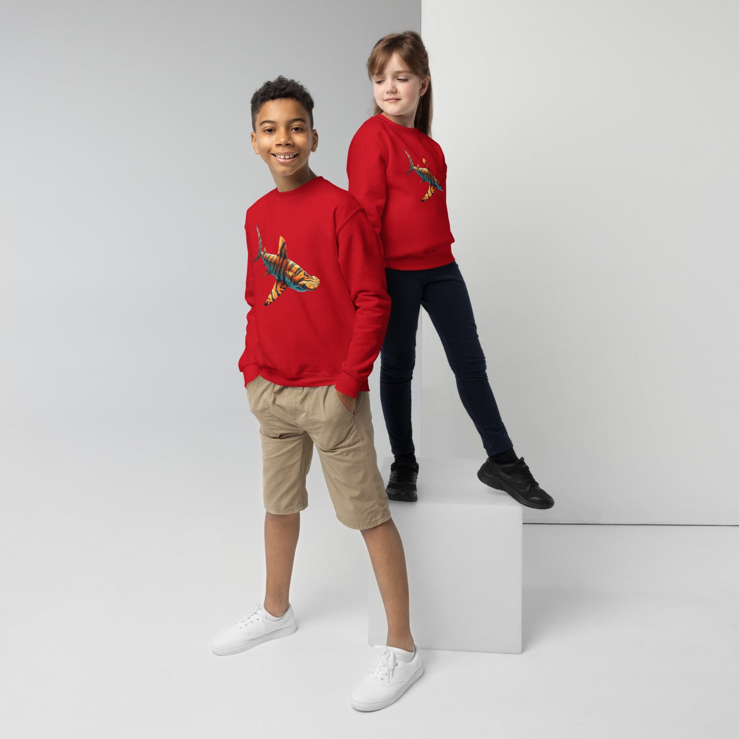 Red sweatshirt for youth with a print of a hammerhead shark