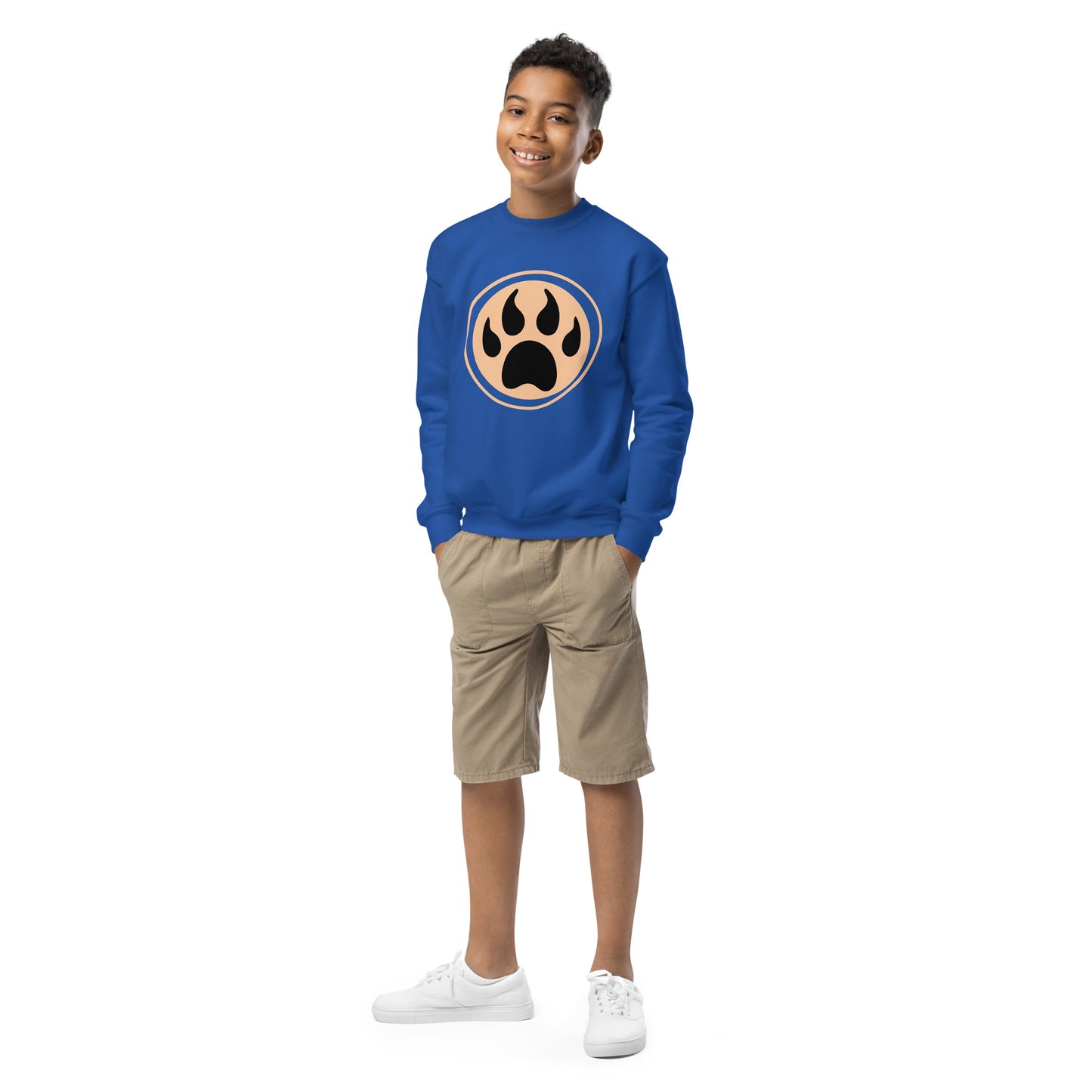 Youth with royal blue sweatshirt and a print of a wolf claw