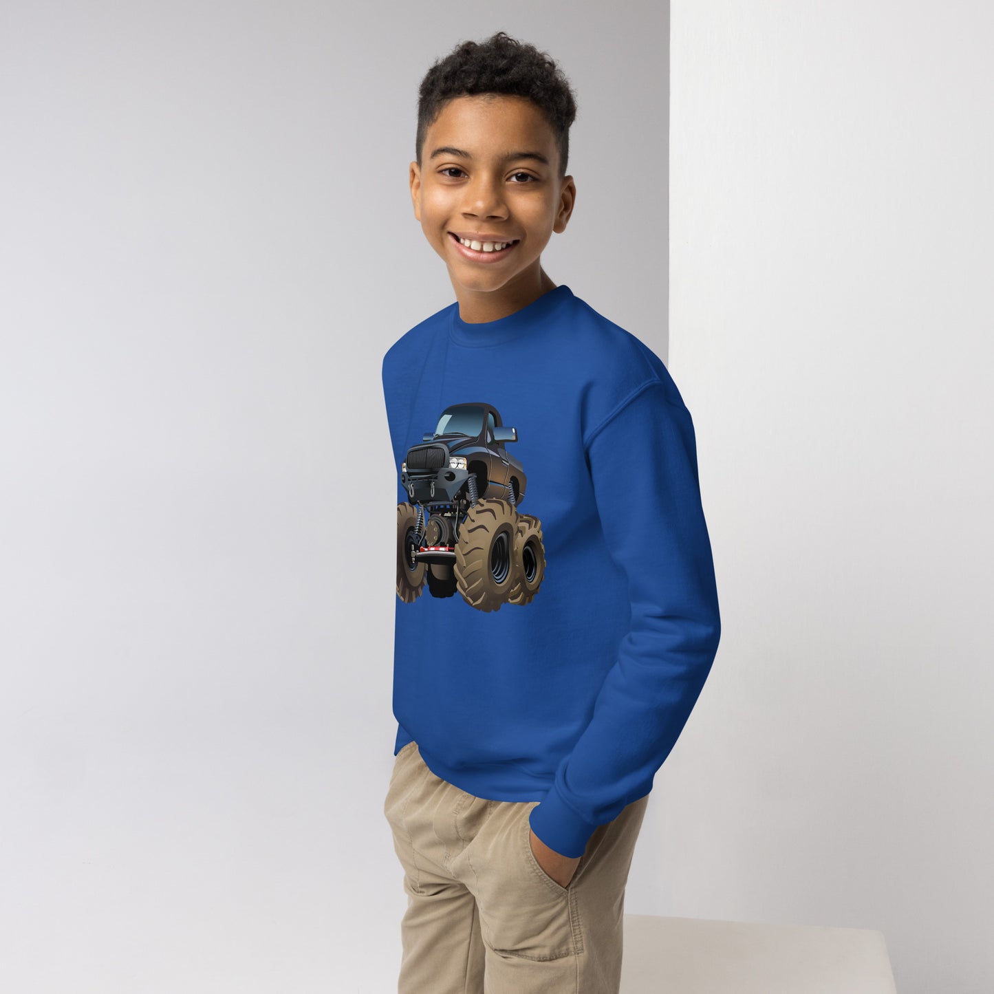 Youth boy with royal blue sweatshirt with picture of a monstertruck