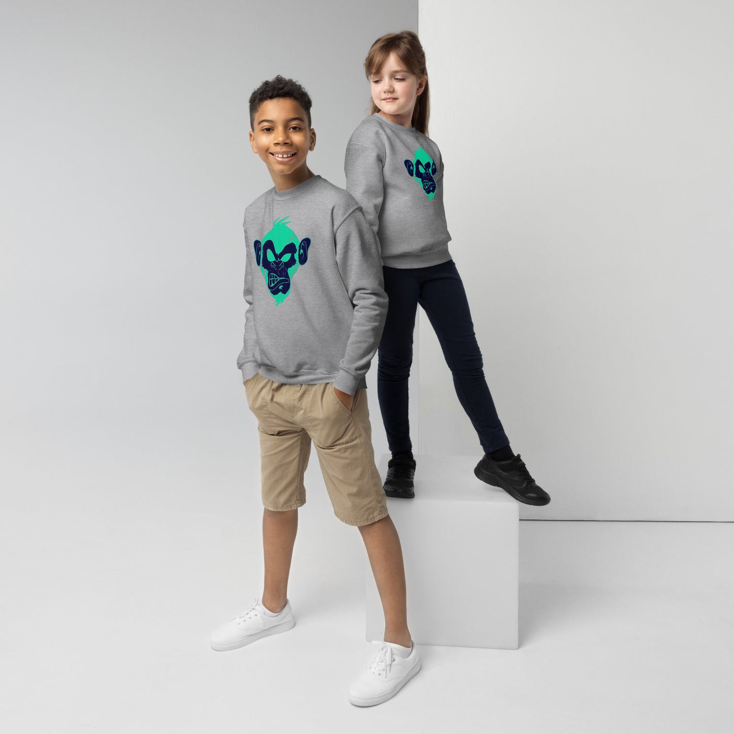Boy and girl with sport grey sweater and print of a Cool monkey in black light green