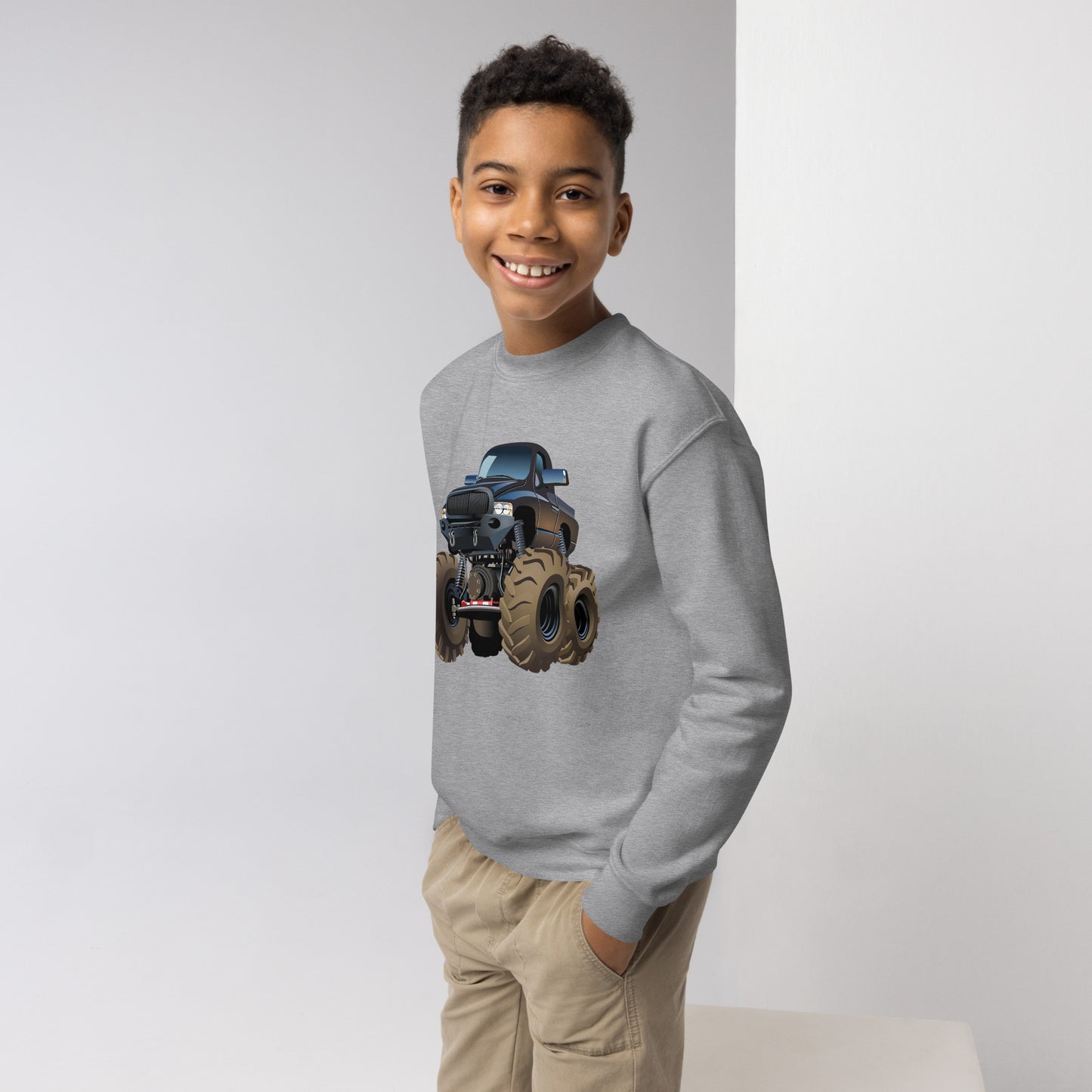 Youth boy with sport grey sweatshirt with picture of a monstertruck