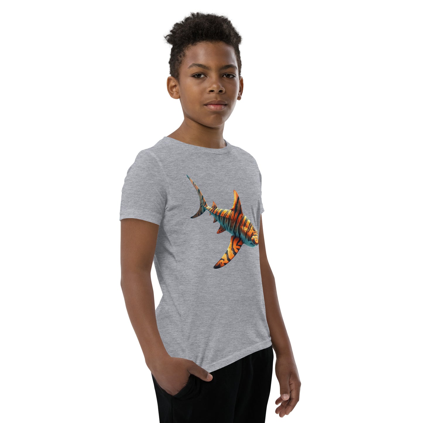 Youth with a grey T-shirt and print of a hammerhead sharp