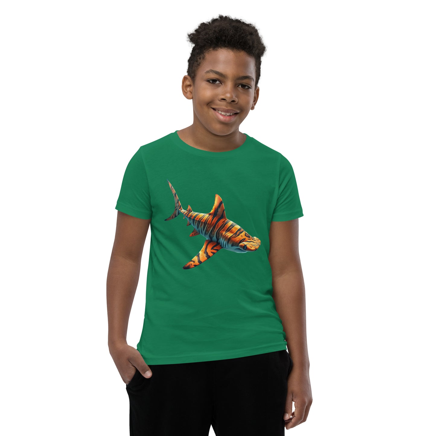 Youth with a green T-shirt and print of a hammerhead sharp